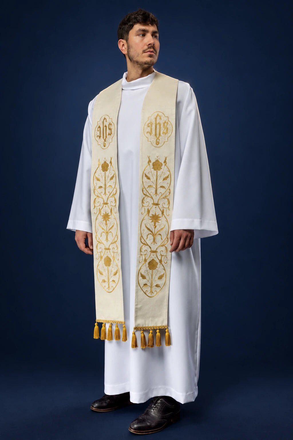 Embroidered Ecru IHS Stole worn from the front, with gold embroidery, floral motifs and tasselled ends