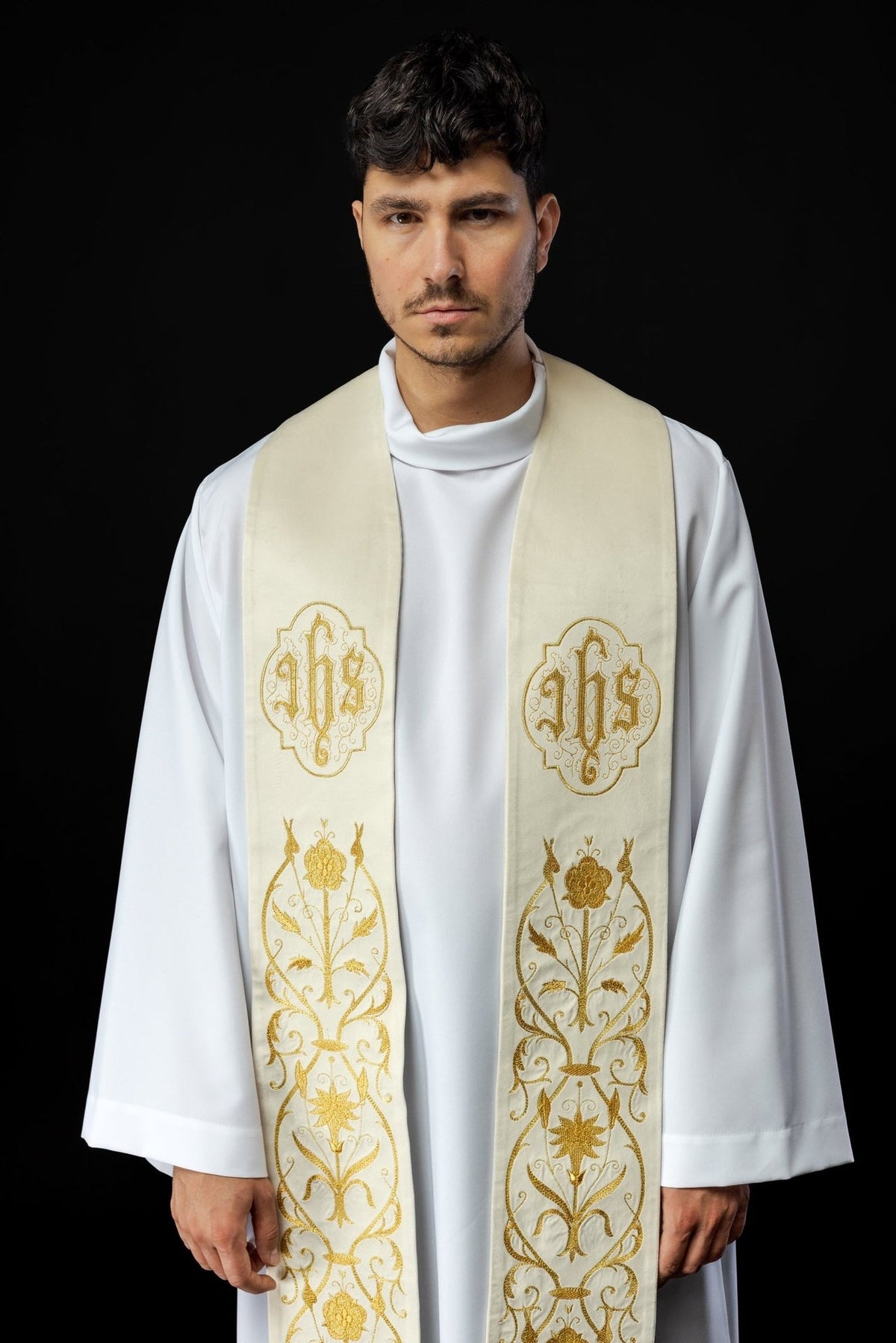 Ecru IHS stole worn close-up, showing gold IHS embroidery and floral embroidery