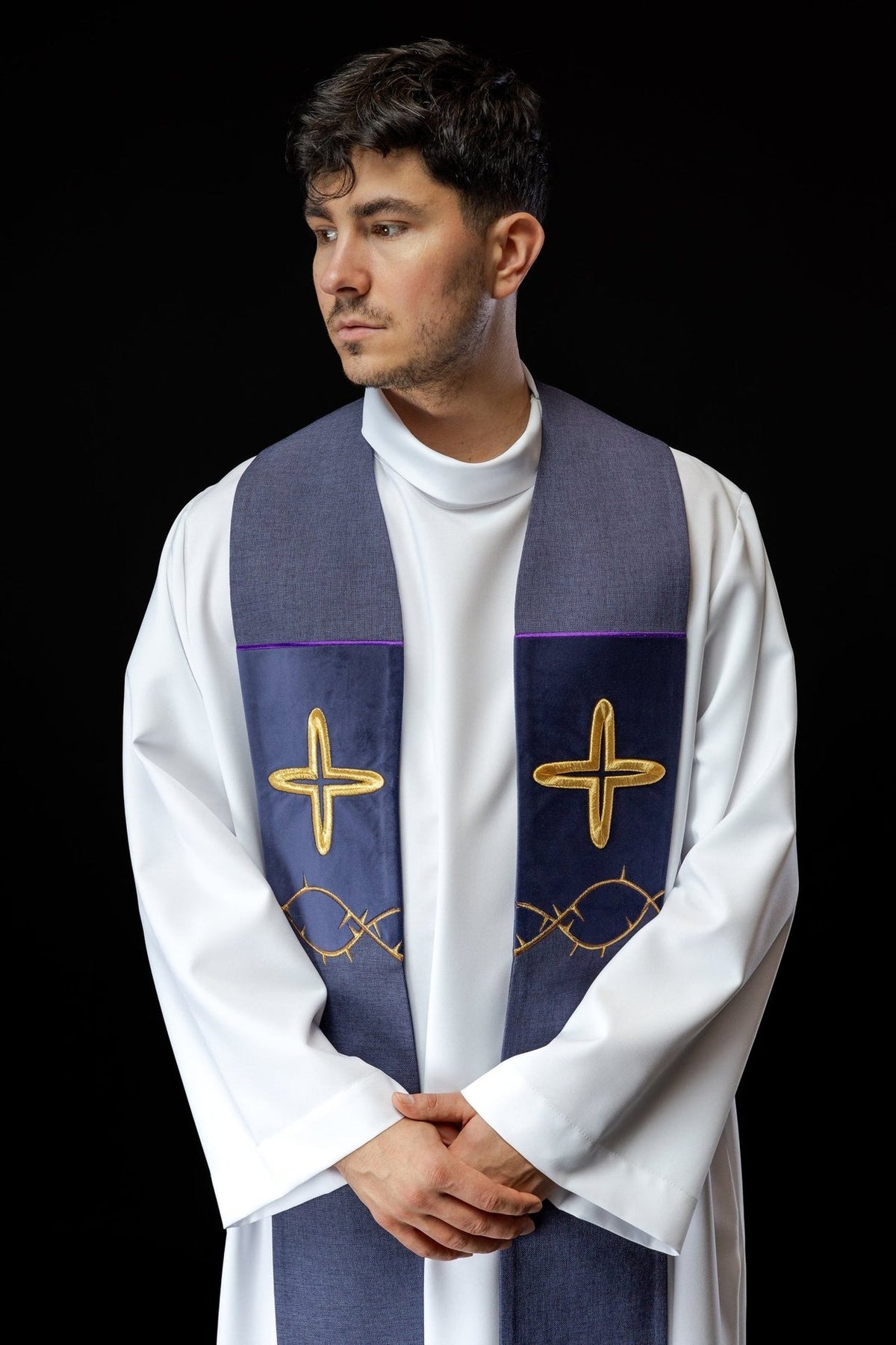 Purple stole worn from the front, showing gold cross and thorn embroidery