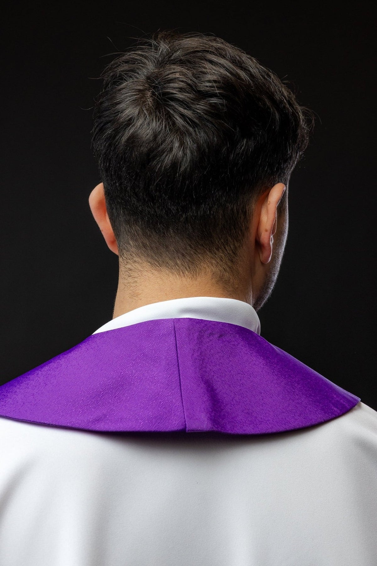 Purple stole back view showing plain fabric and central seam