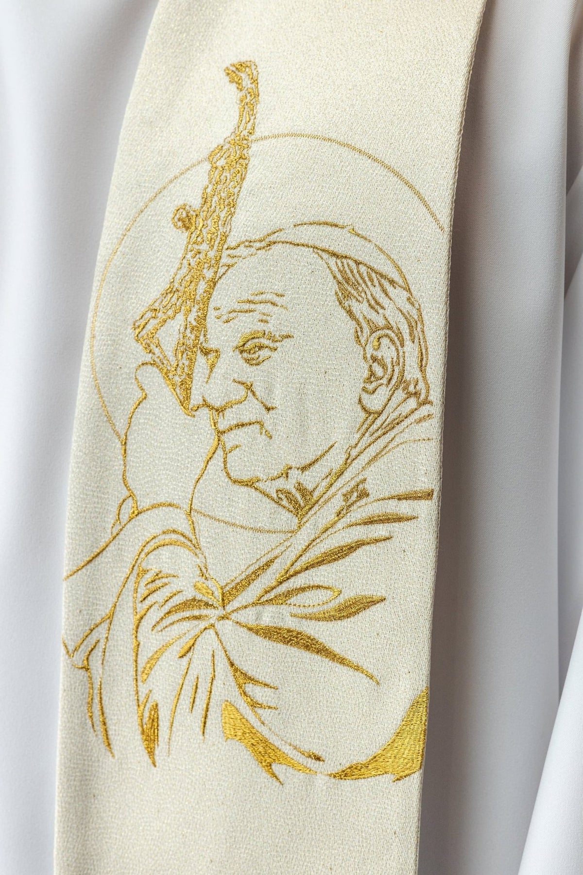 John Paul II stole close-up showing gold embroidered portrait on ivory fabric