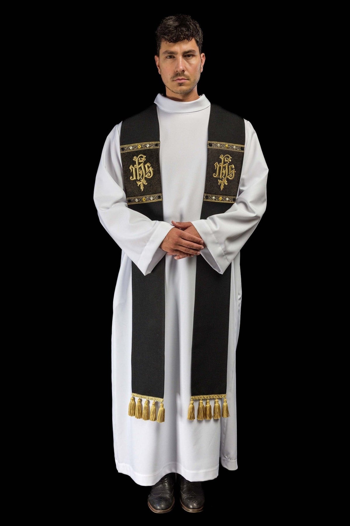 Black stole worn front view showing IHS embroidery and gold tassels