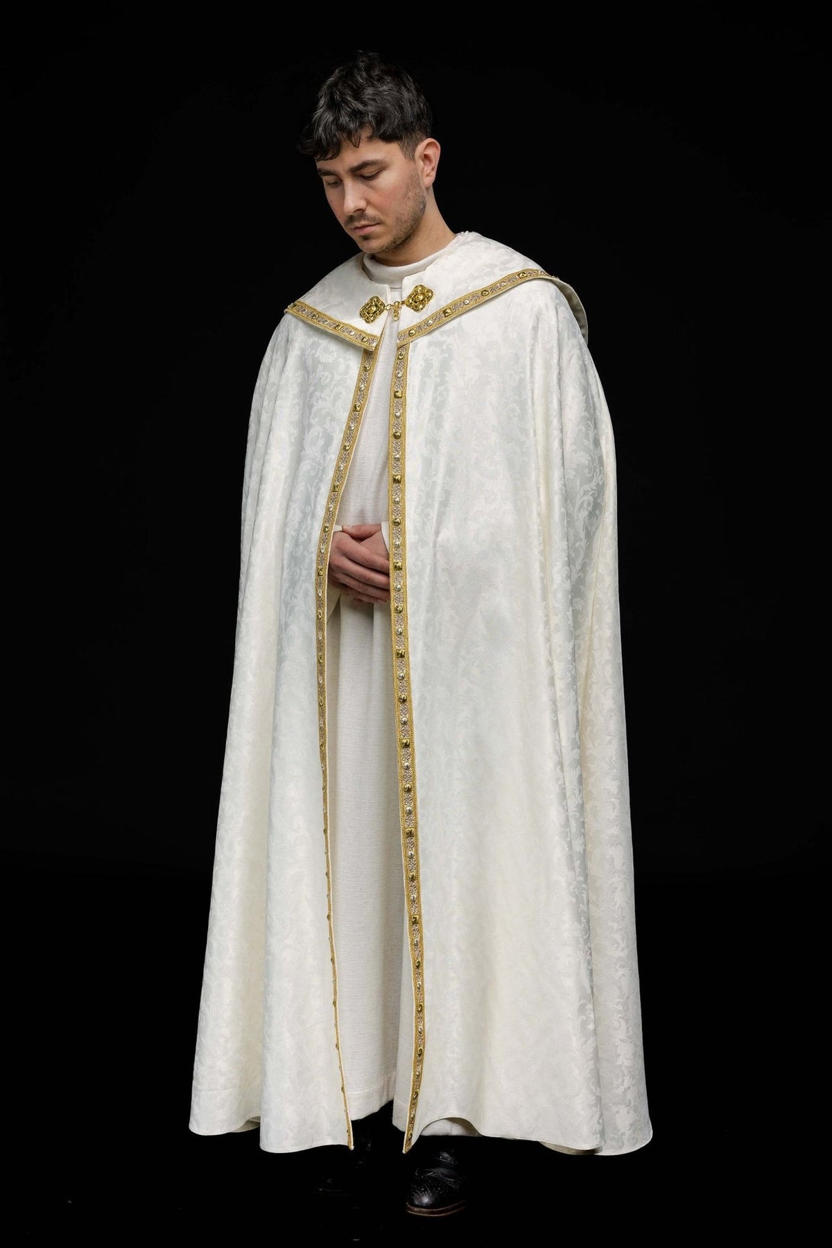 Ecru cope with Paschal Lamb design, front view with gold trim and jacquard pattern
