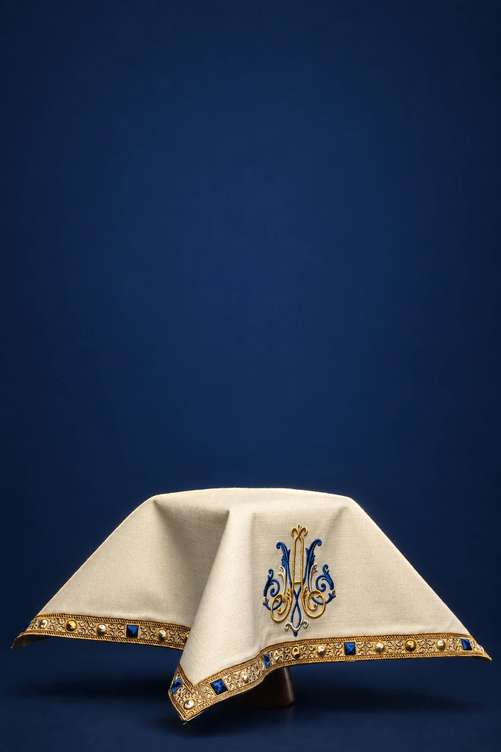 Ecru Chalice Veil with Marian Embroidery, front view with blue and gold embroidery and decorative border