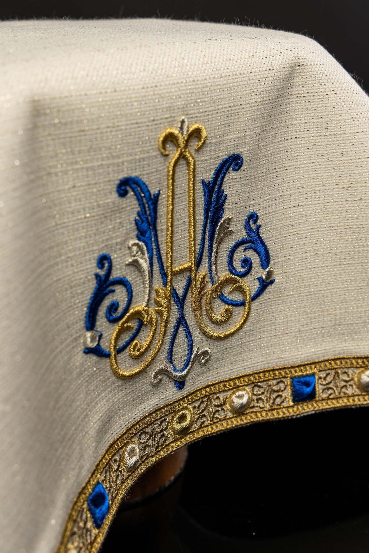 Chalice veil close-up showing Marian embroidery and ornate gold border