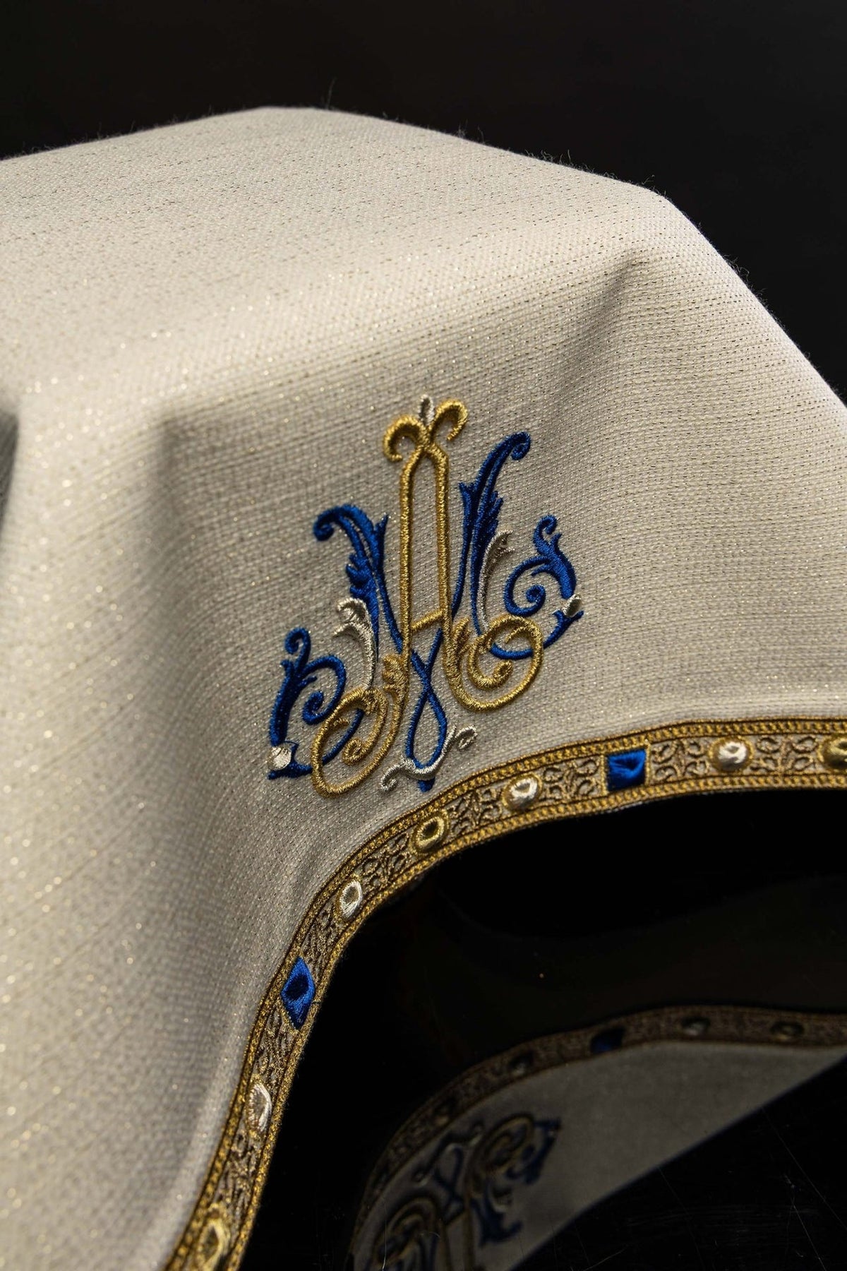 Chalice veil close-up showing blue, gold and silver Marian embroidery