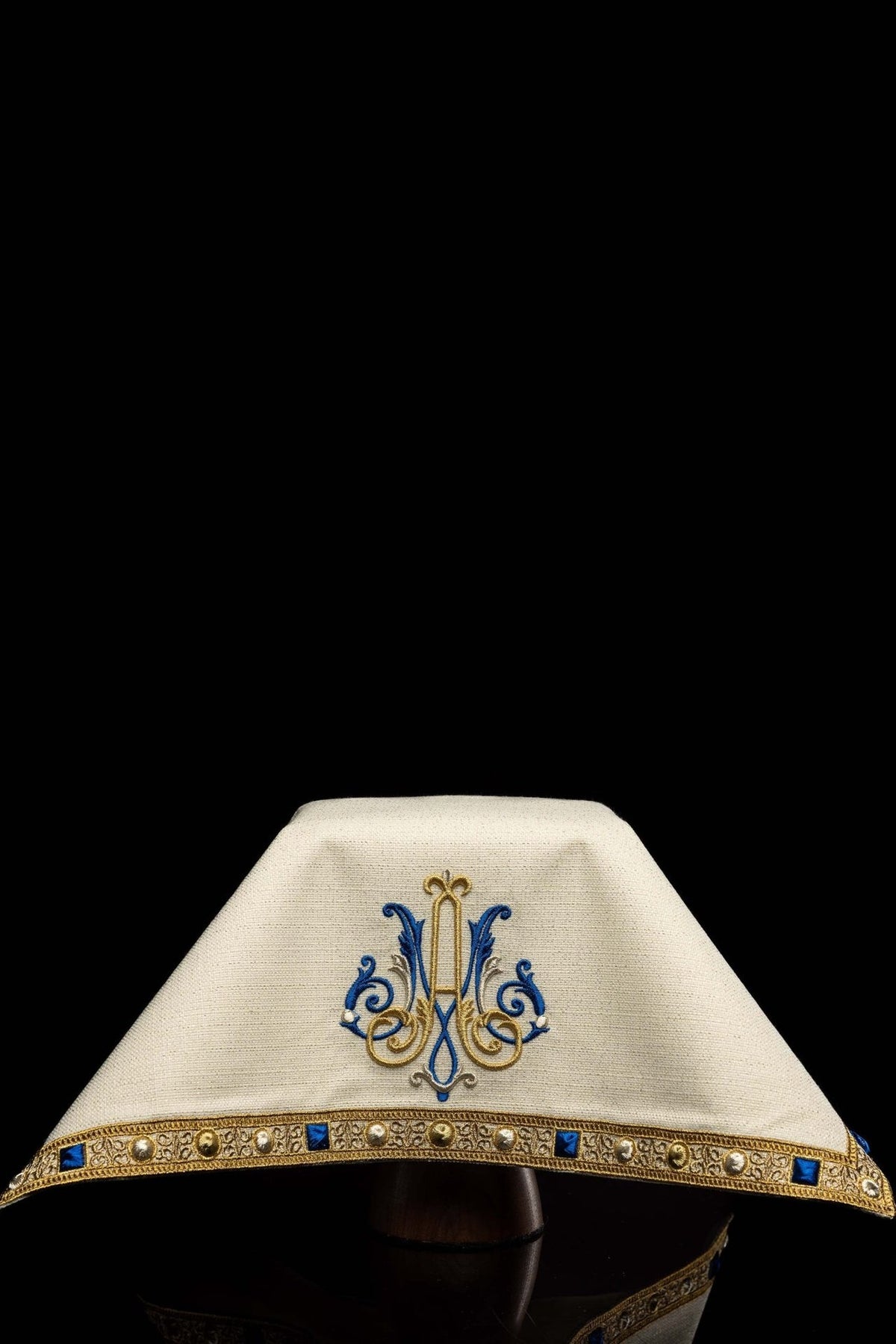 Chalice veil front view showing centered Marian motif and decorative embroidered border