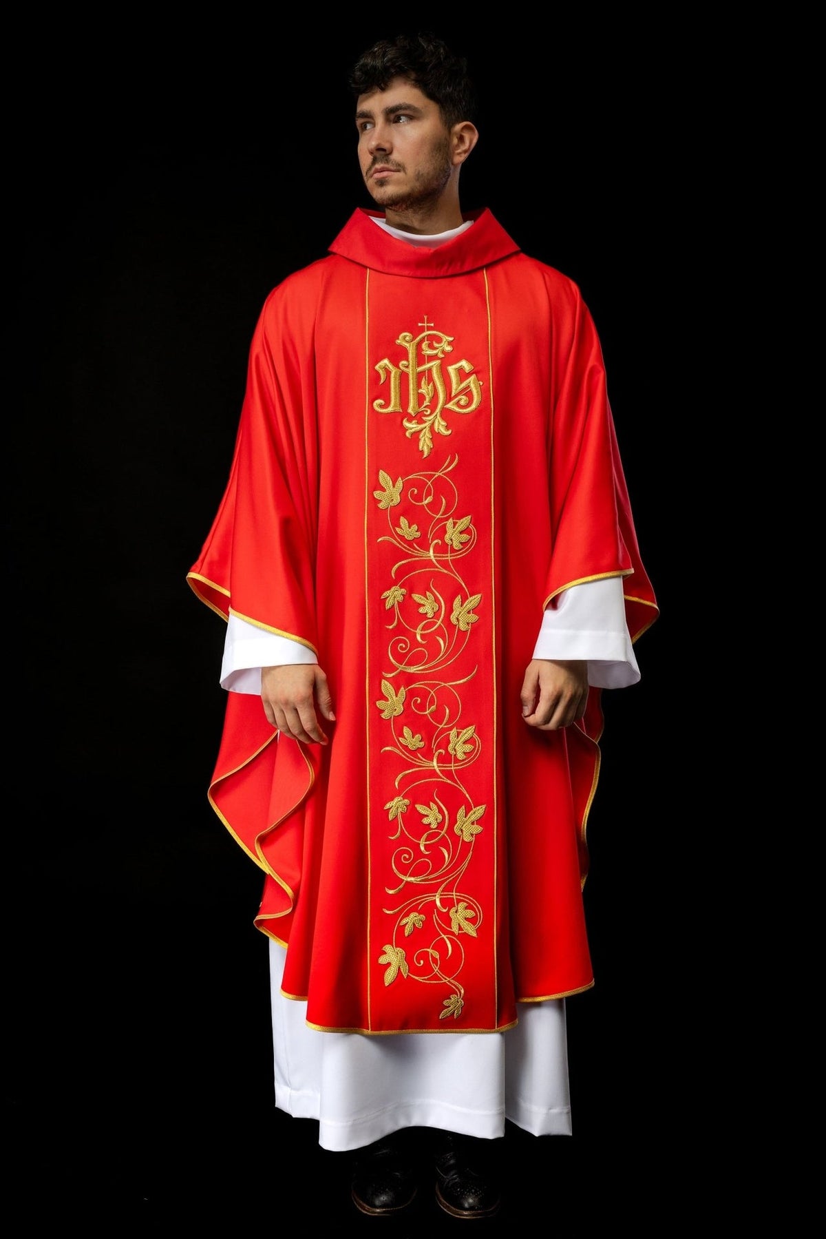 Red chasuble front view with gold IHS and floral embroidery