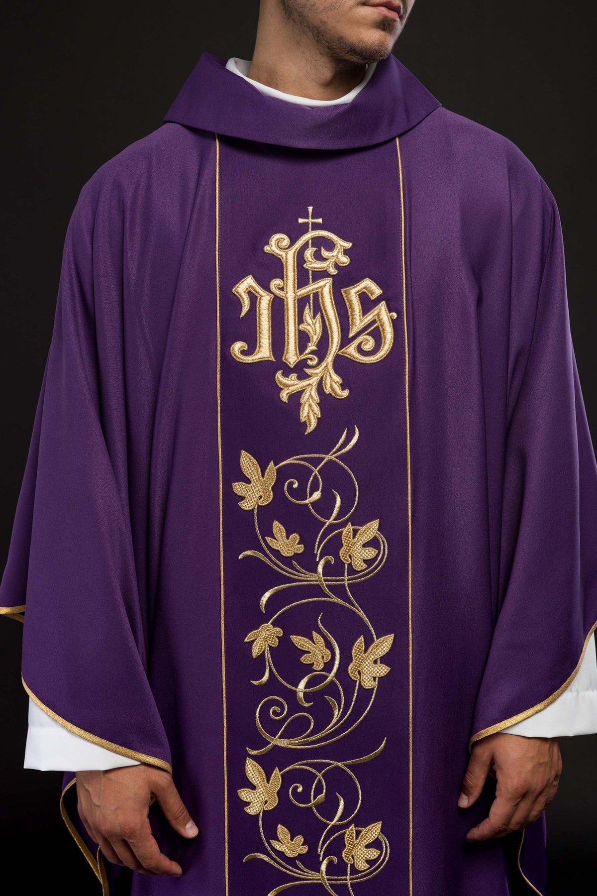 Purple chasuble, close-up front view of gold IHS and floral embroidery