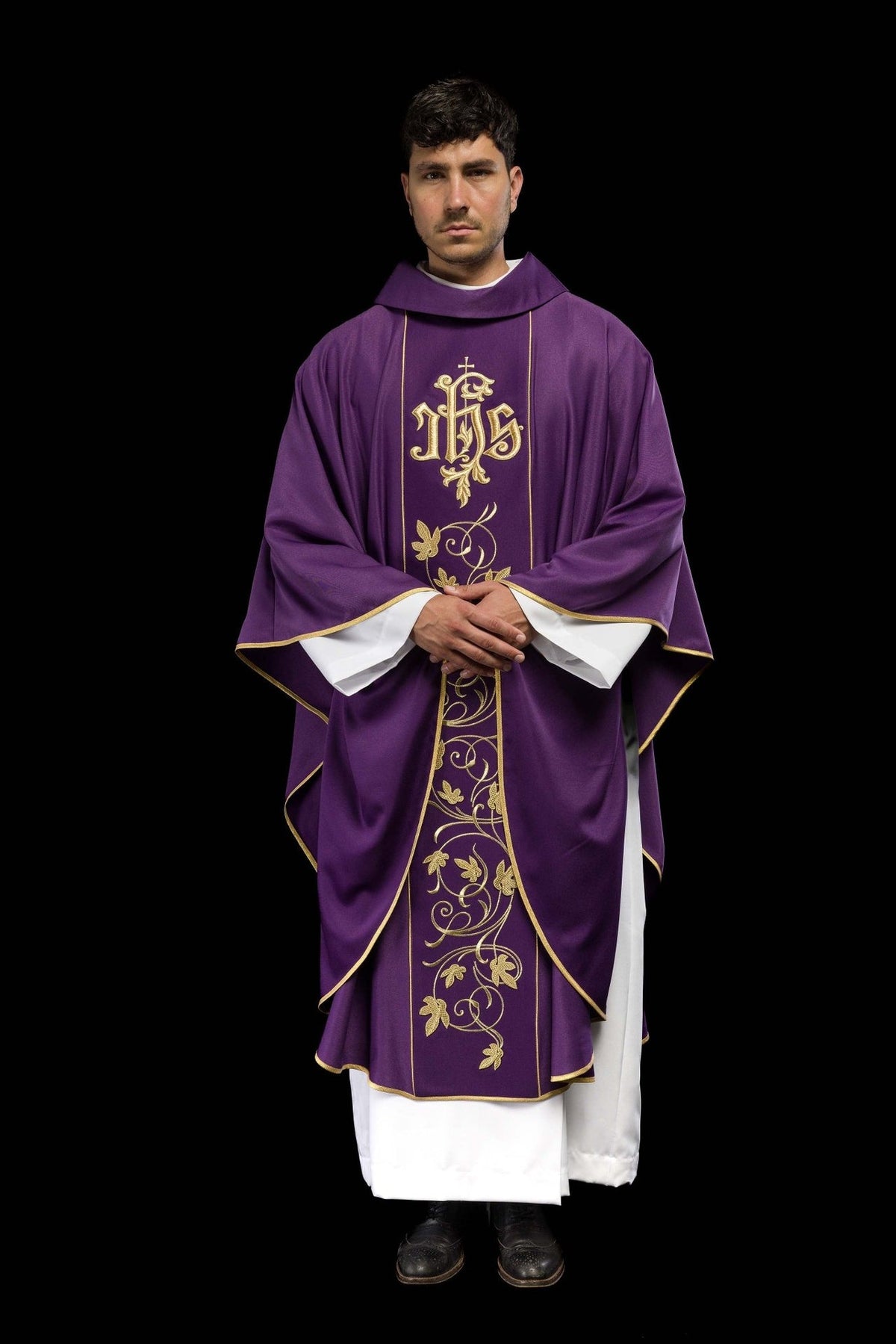 Purple chasuble, front worn view with flowing sleeves and gold embroidery