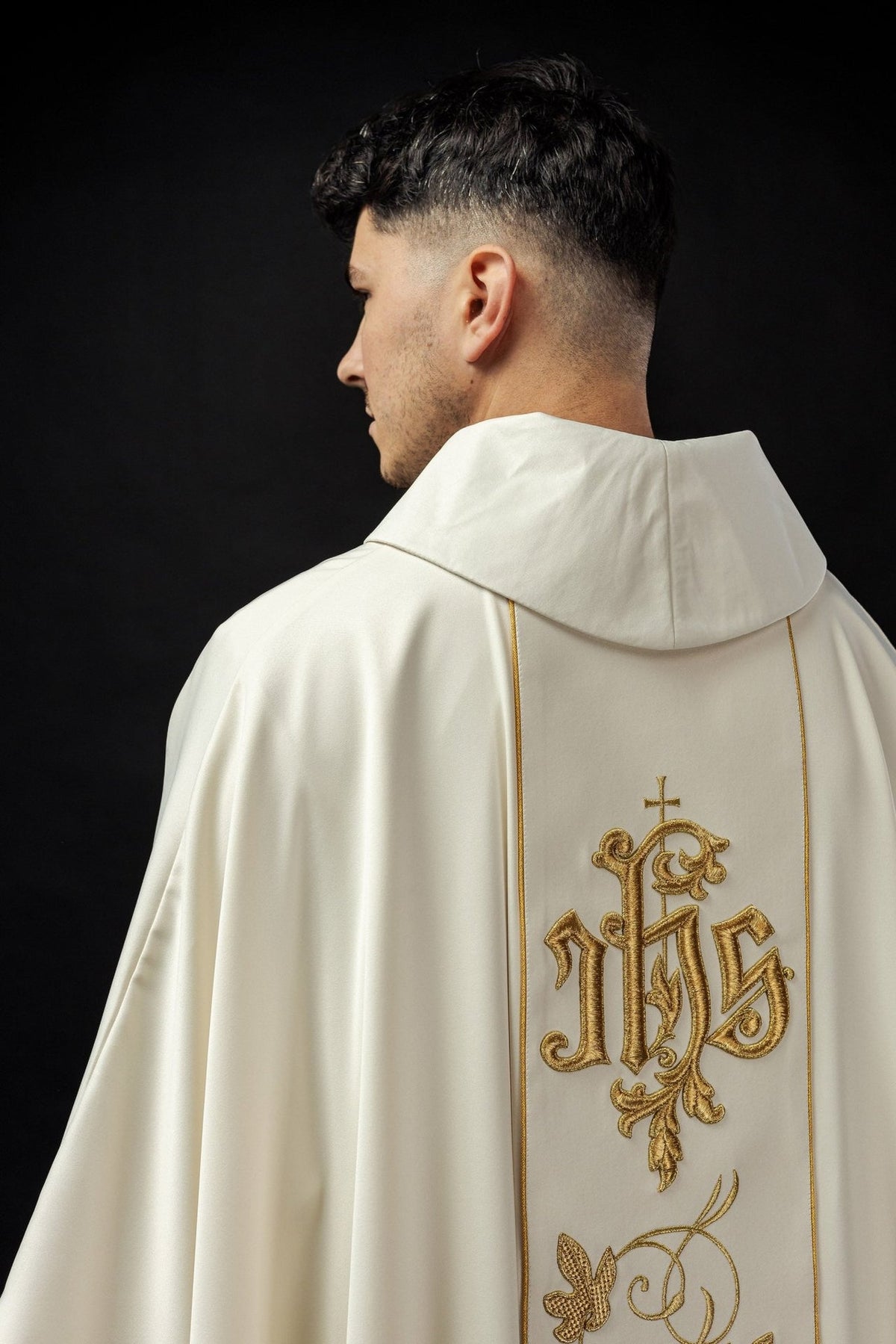 Ecru chasuble back view with gold floral orphrey and IHS embroidery