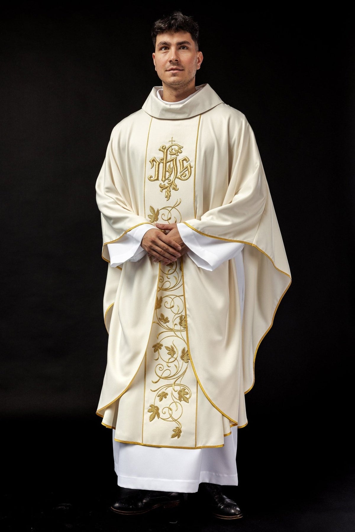 Ecru chasuble front view showing gold-trimmed edges and floral embroidery