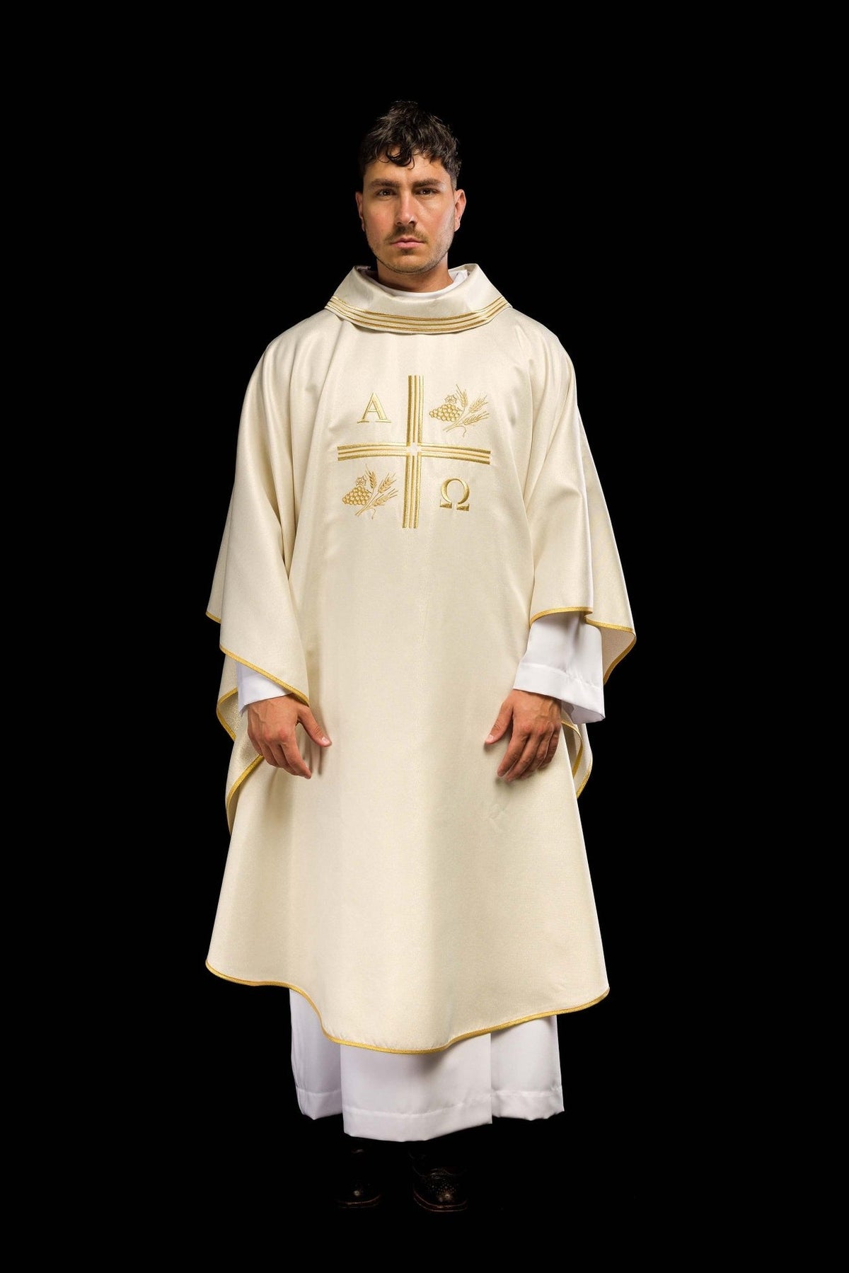 Ecru chasuble worn full-length from the front with gold trim