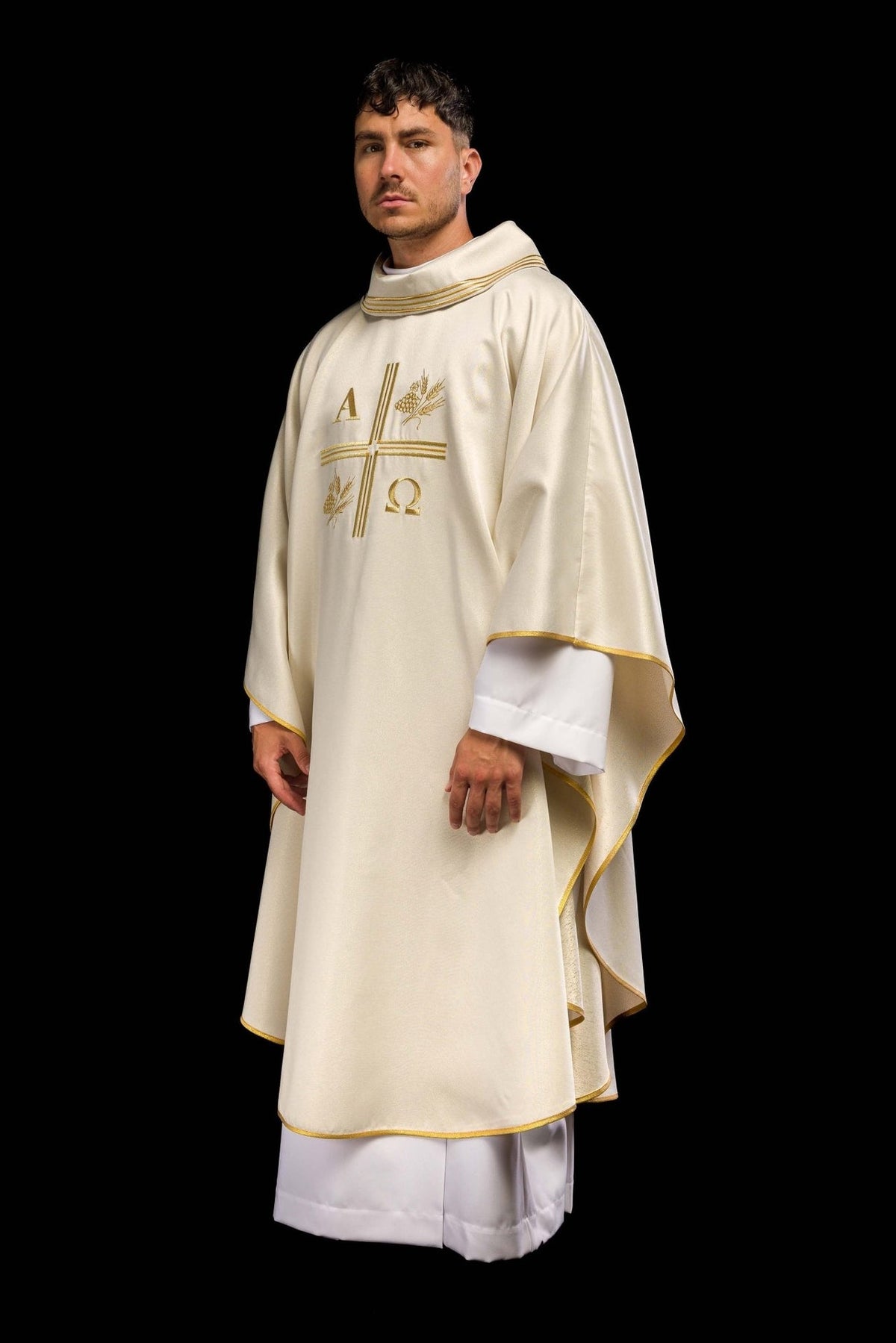 Ecru chasuble side view with gold-trimmed sleeves and embroidered front
