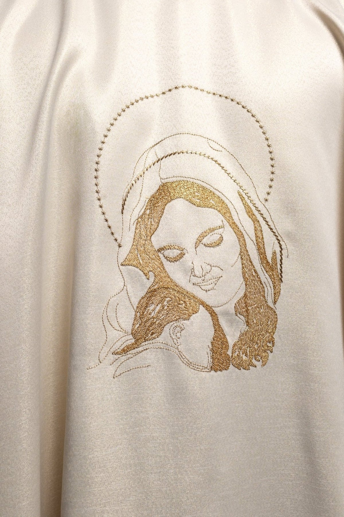 Liturgical chasuble close-up of embroidered Our Lady embracing Jesus in gold