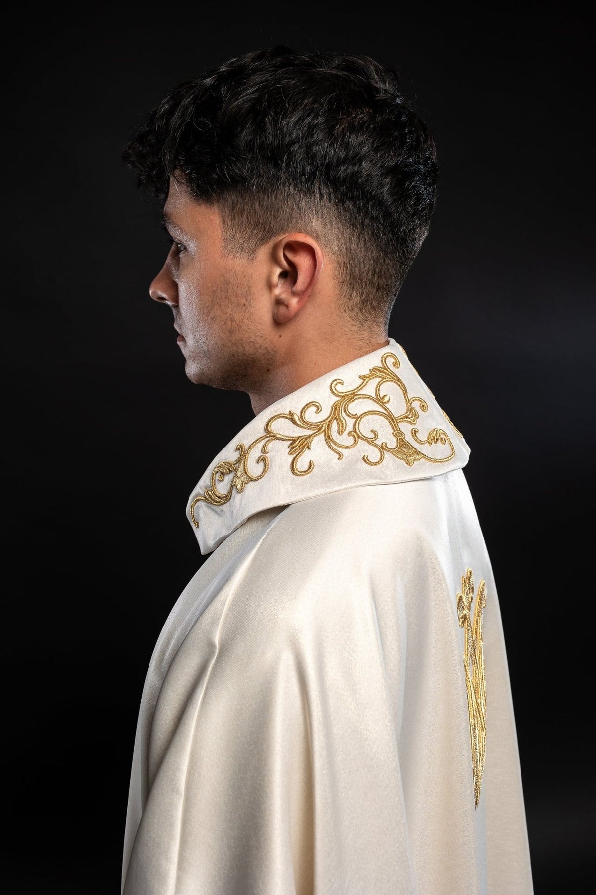 Liturgical chasuble side-back view with gold embroidery on the stand-up collar