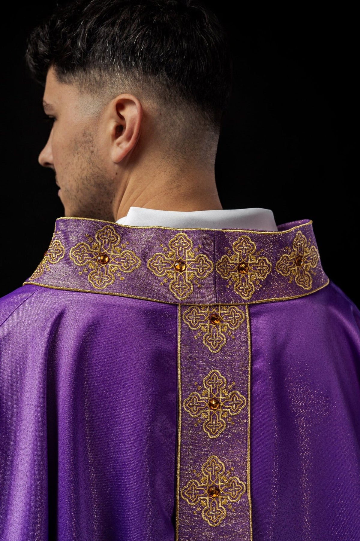 Purple chasuble back view with gold embroidered orphrey and collar