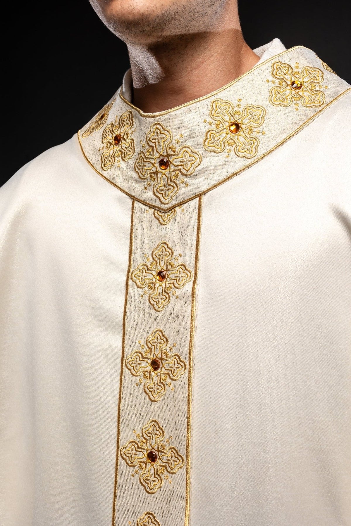 Ecru chasuble collar close-up with gold embroidery and stone adornments