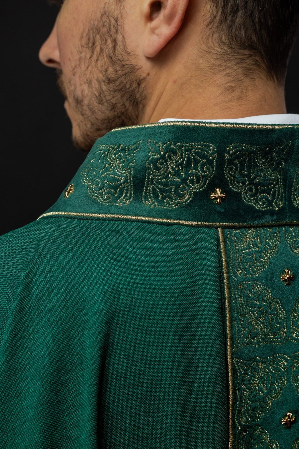 Green chasuble back close-up with embroidered gold collar and orphrey