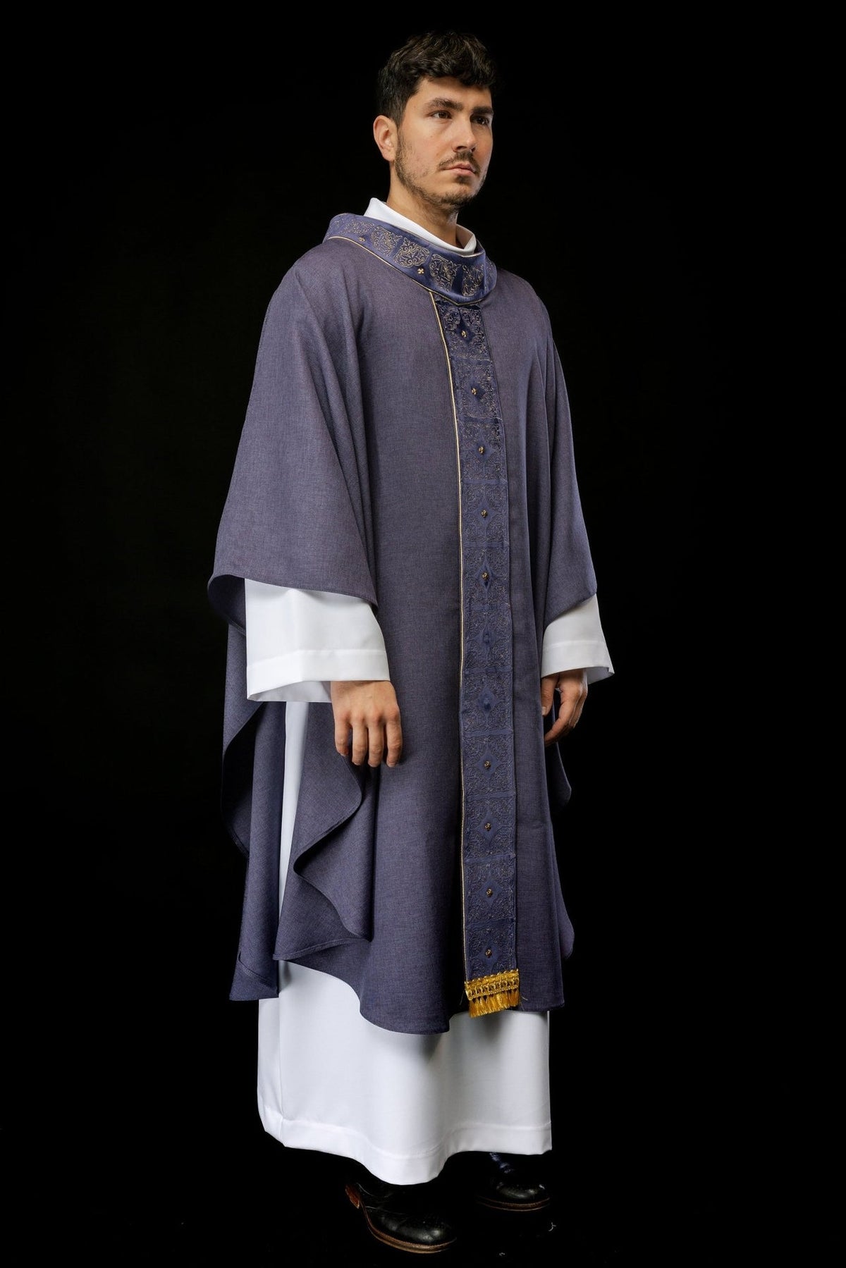Purple chasuble worn in full front view with embroidered orphrey and gold trim