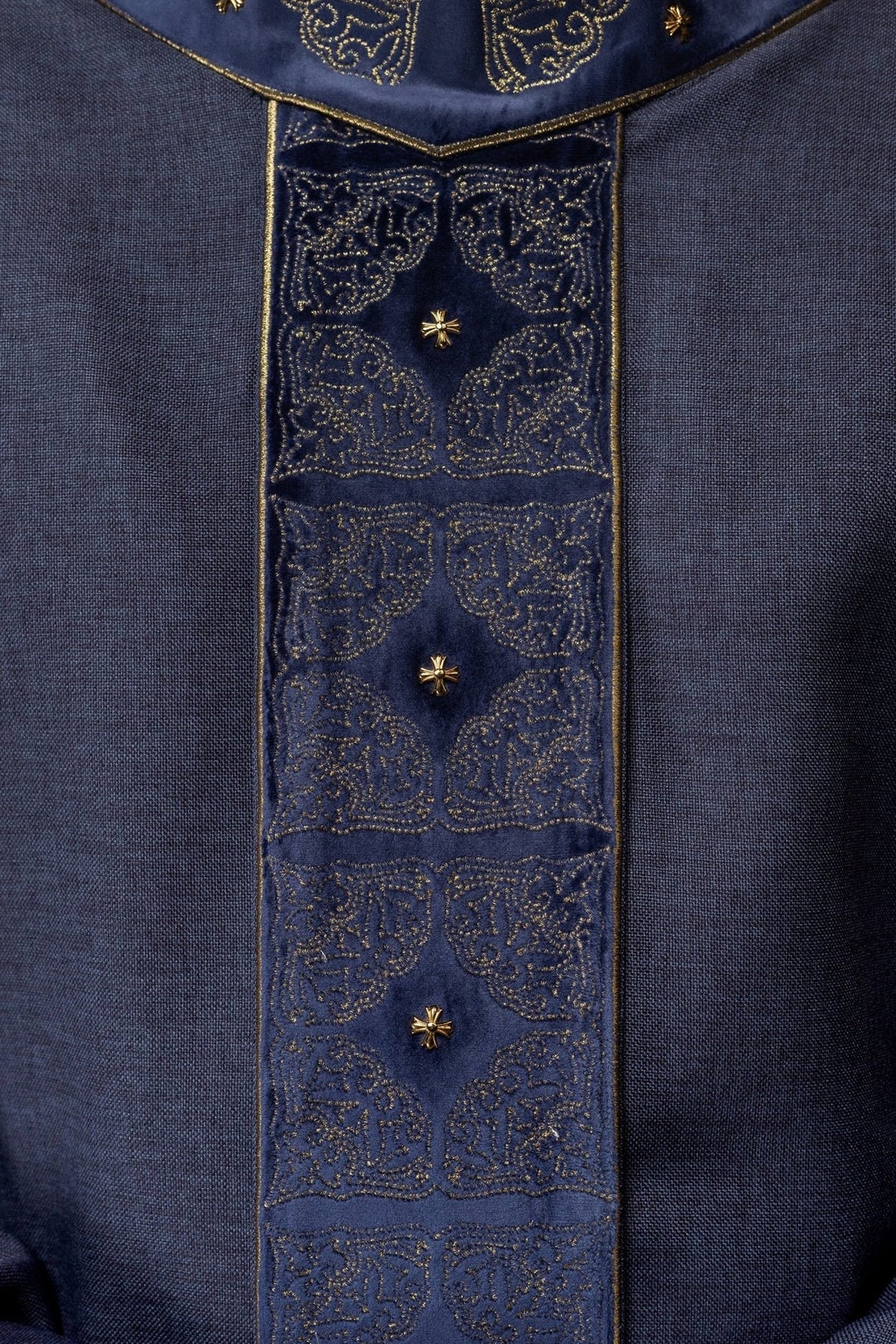 Purple chasuble front close-up with embroidered stand-up collar and ornate gold motifs