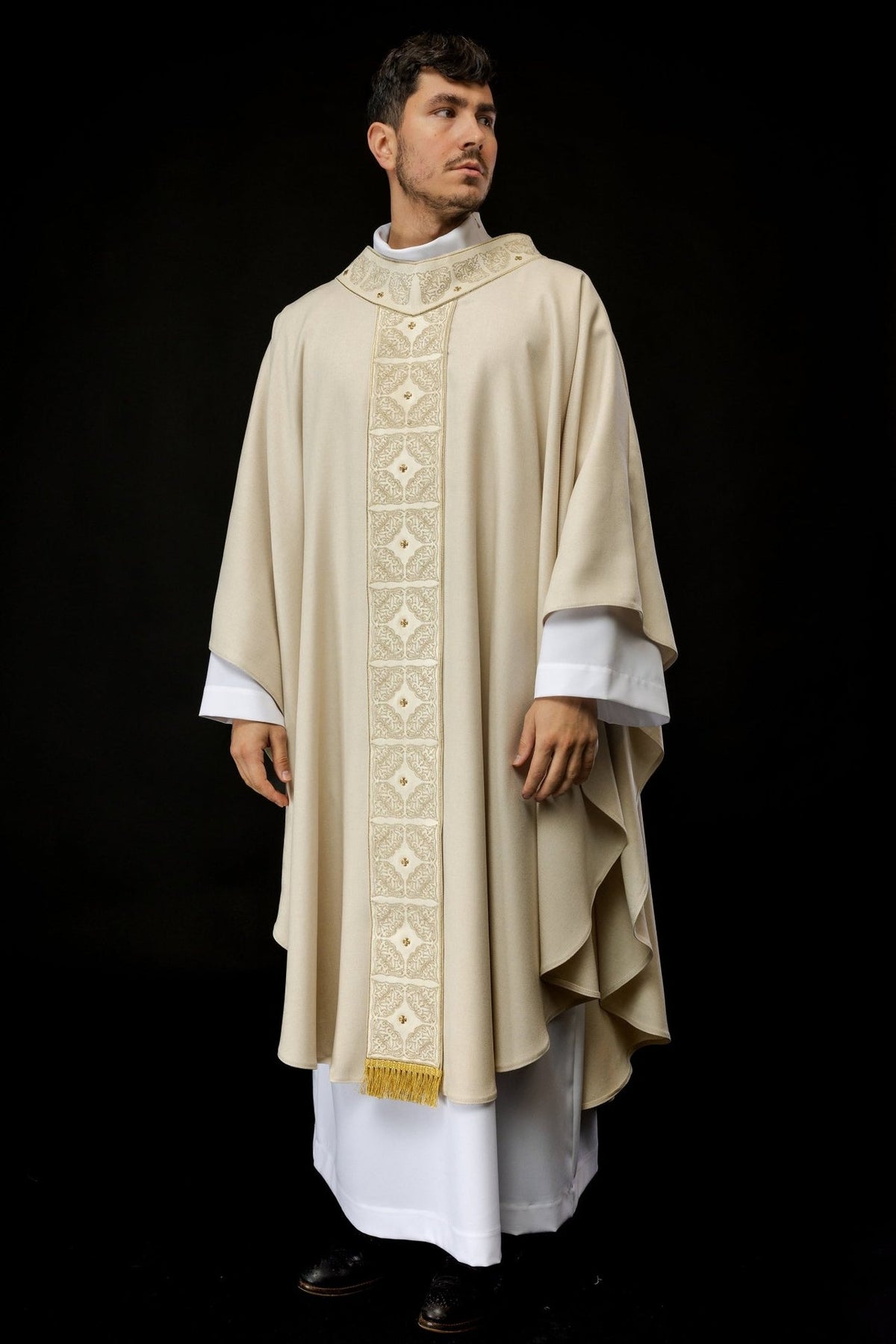 Ecru chasuble front view with embroidered orphrey and gold fringe