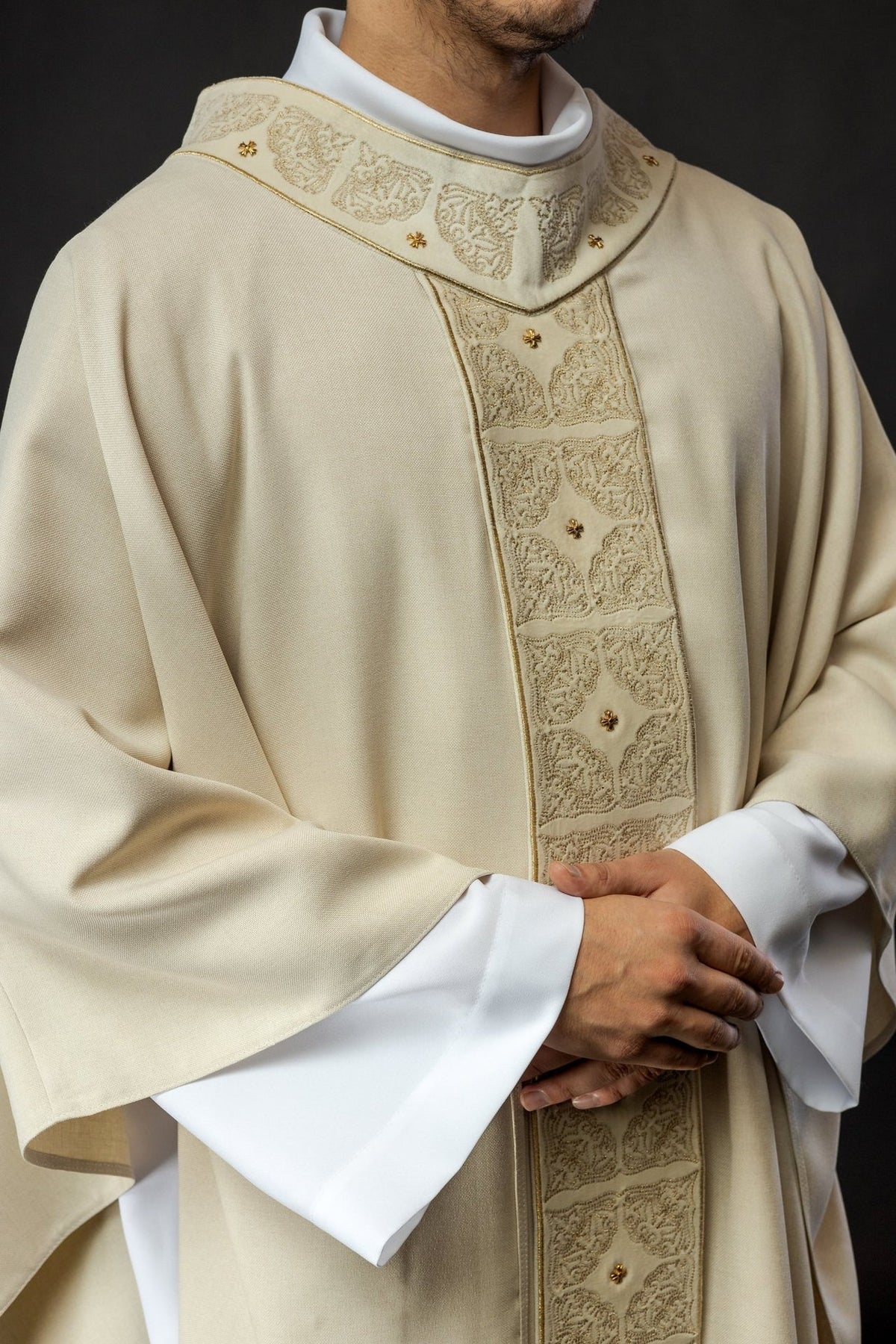 Ecru chasuble close-up showing embroidered orphrey and collar