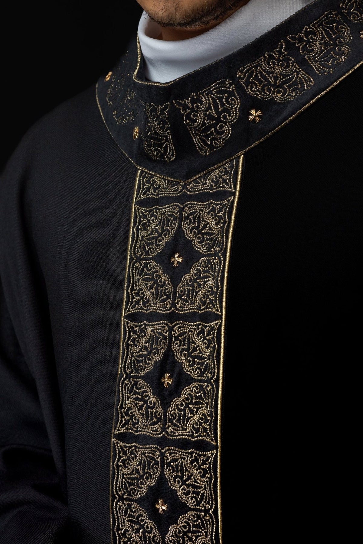 Black chasuble close-up of gold embroidery on the orphrey and collar