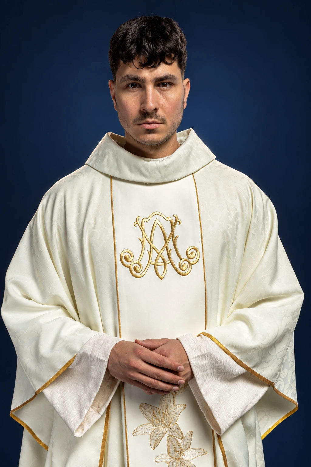 Catholic Chasuble with Embroidered Lilies, front view in ivory with gold Marian monogram and lilies