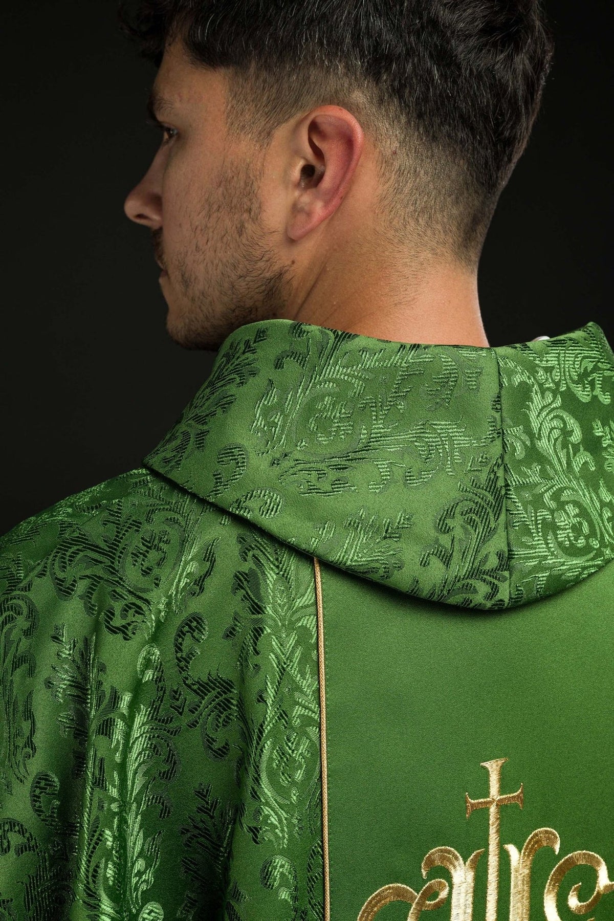Green chasuble side close-up with stand-up collar and patterned satin
