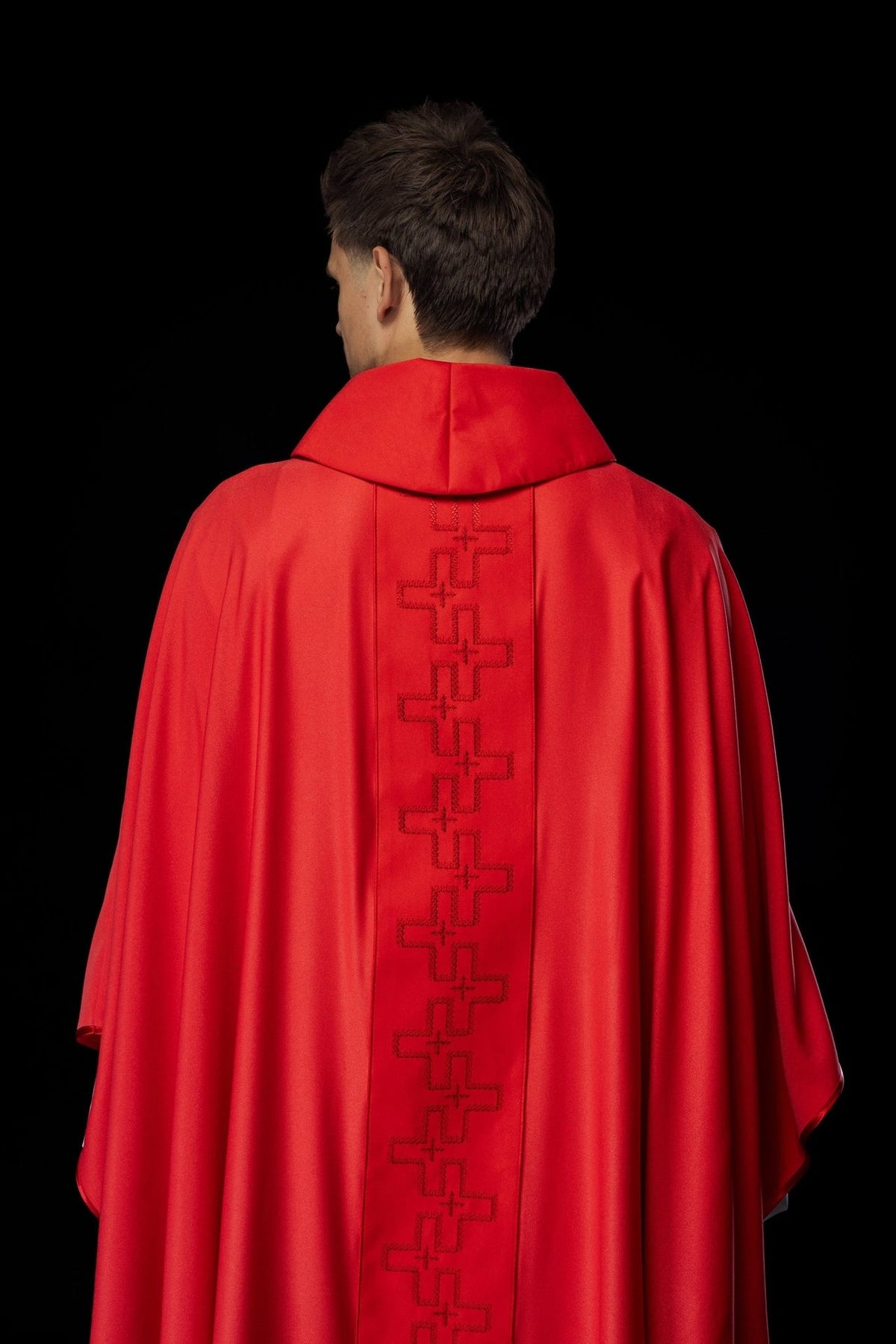 Red chasuble back view with cross embroidery on the orphrey