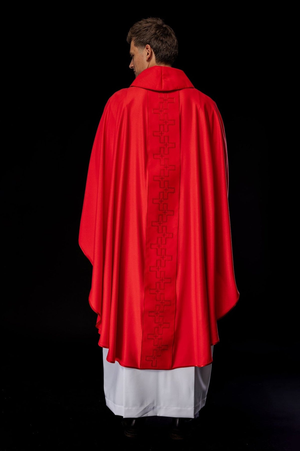 Red chasuble back view showing the full embroidered orphrey