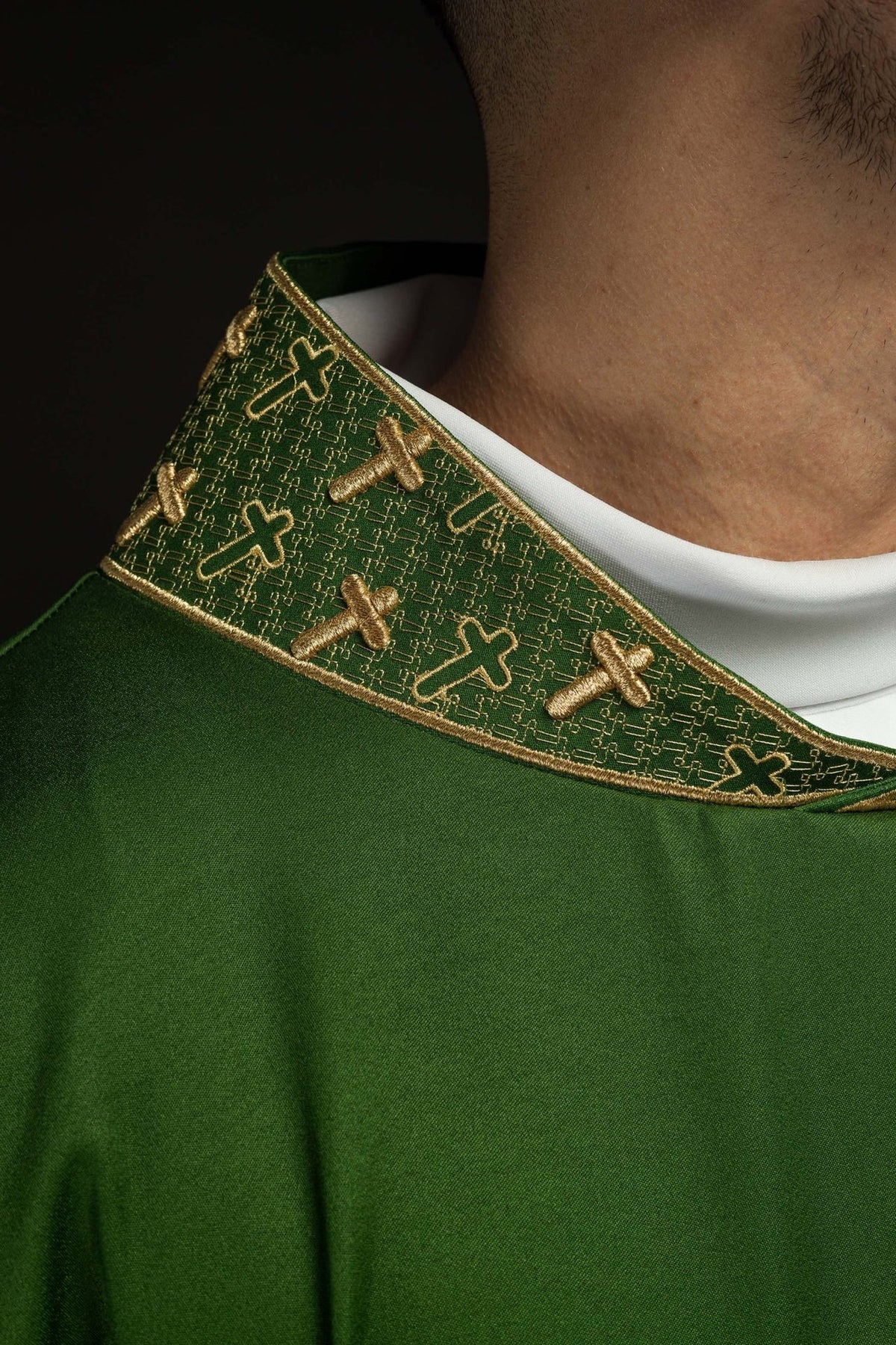 Green chasuble close-up of green collar with gold cross embroidery