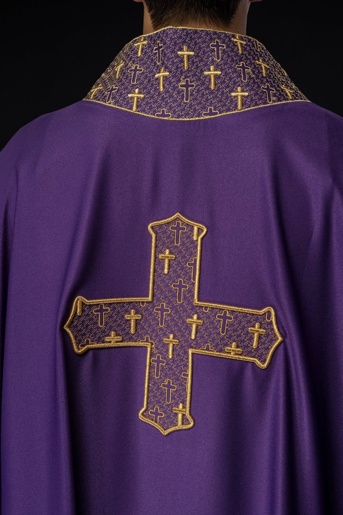 Purple chasuble back view with gold embroidered cross and collar