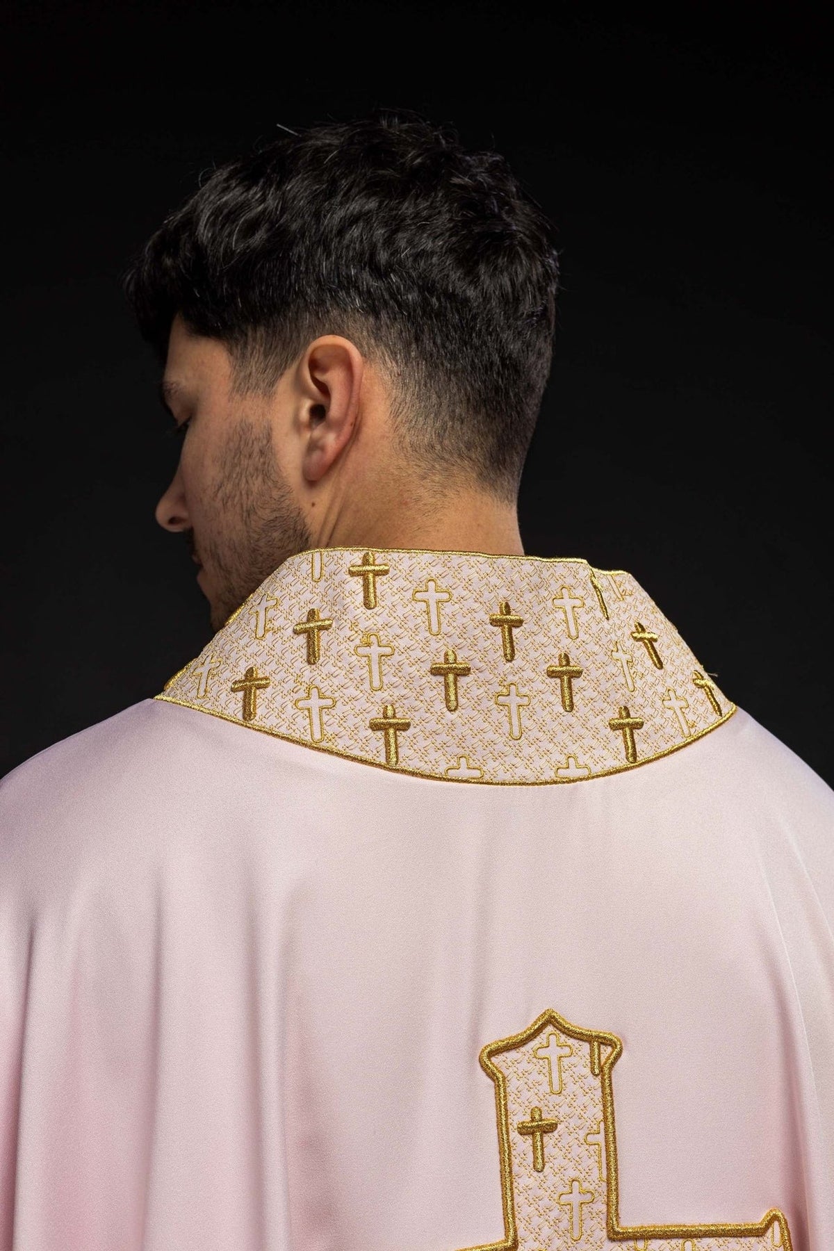 Rose chasuble back view with gold embroidered crosses on the collar