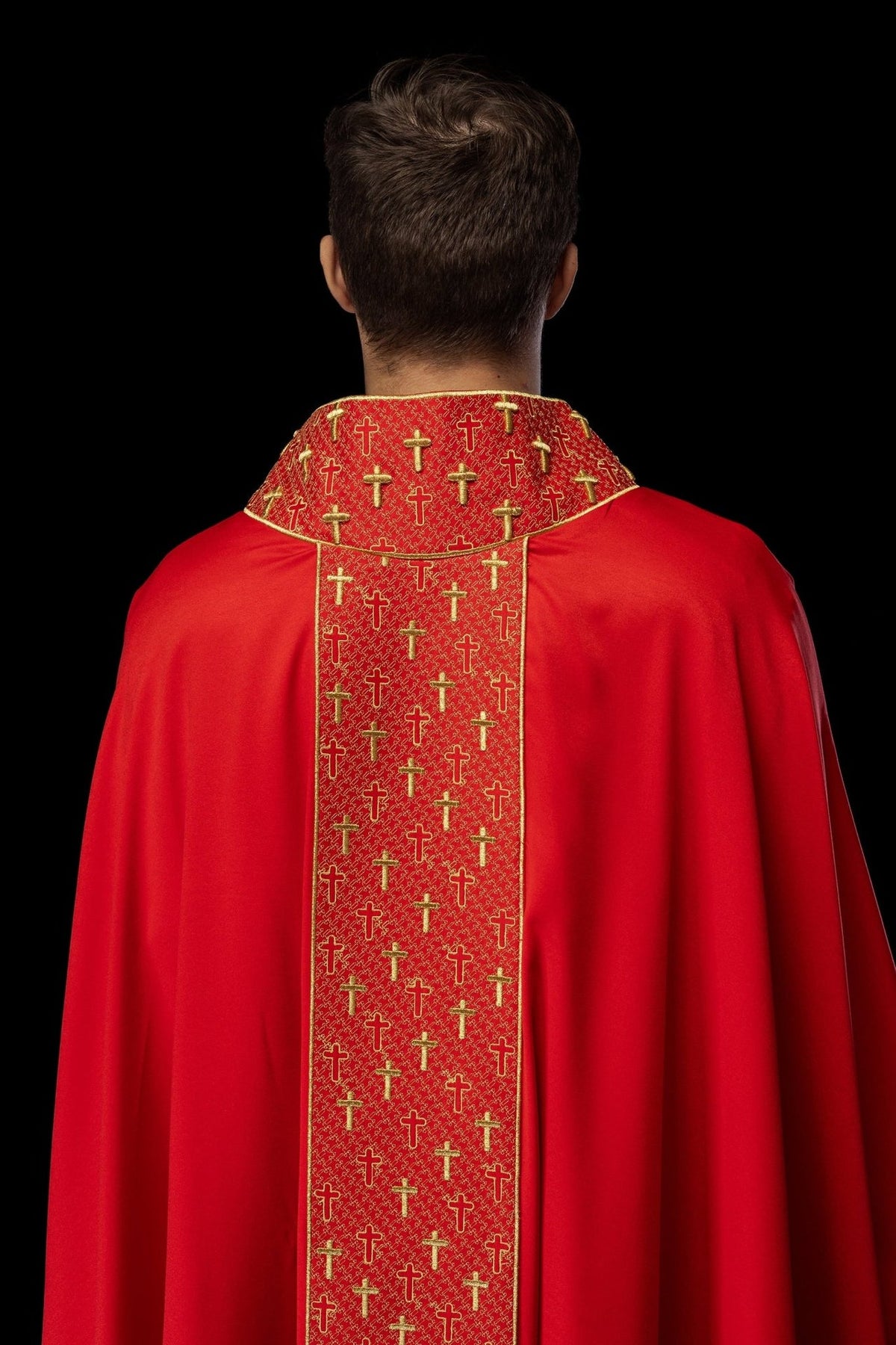 Red chasuble back view with embroidered orphrey and crosses