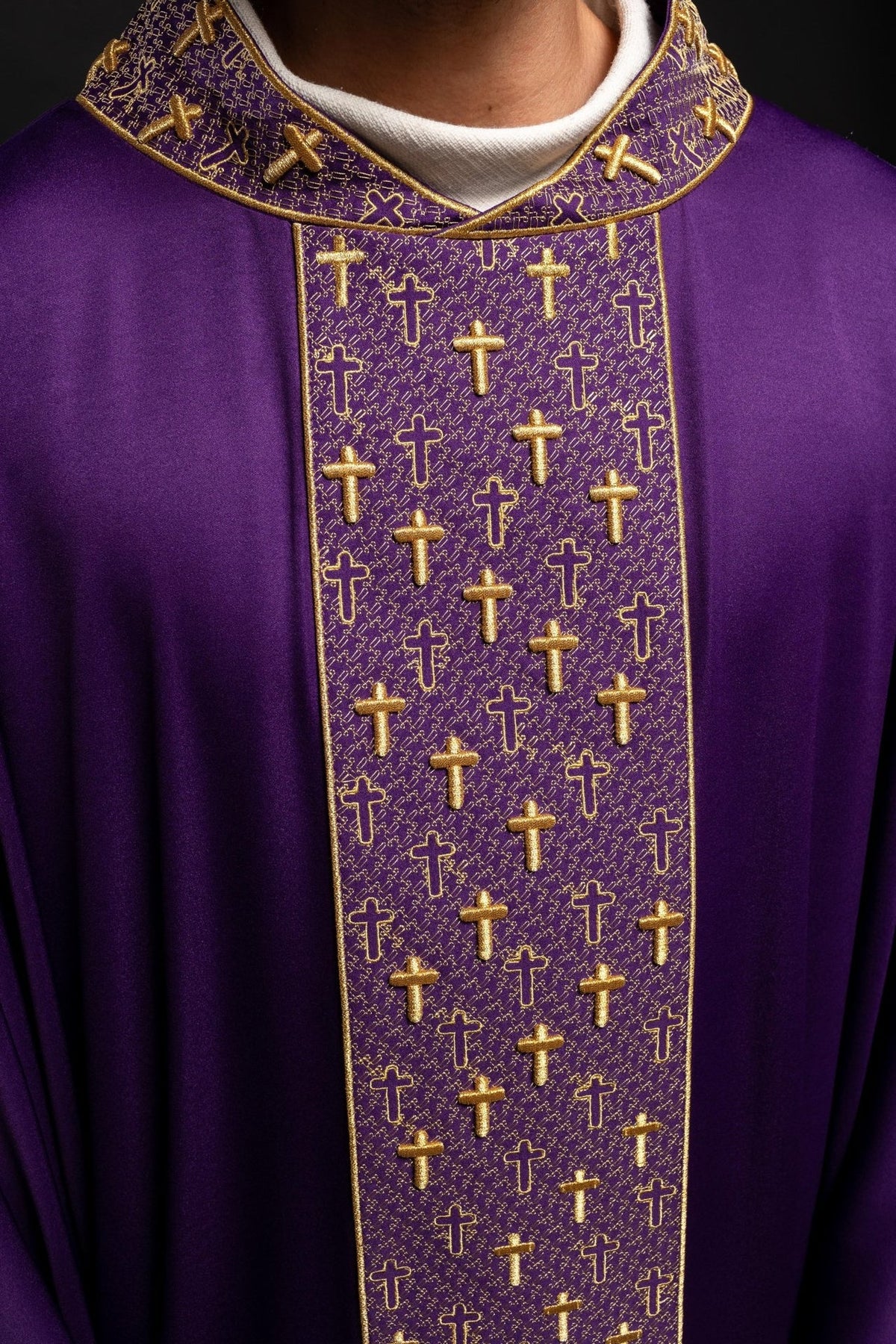 Purple chasuble close-up of embroidered orphrey with gold crosses