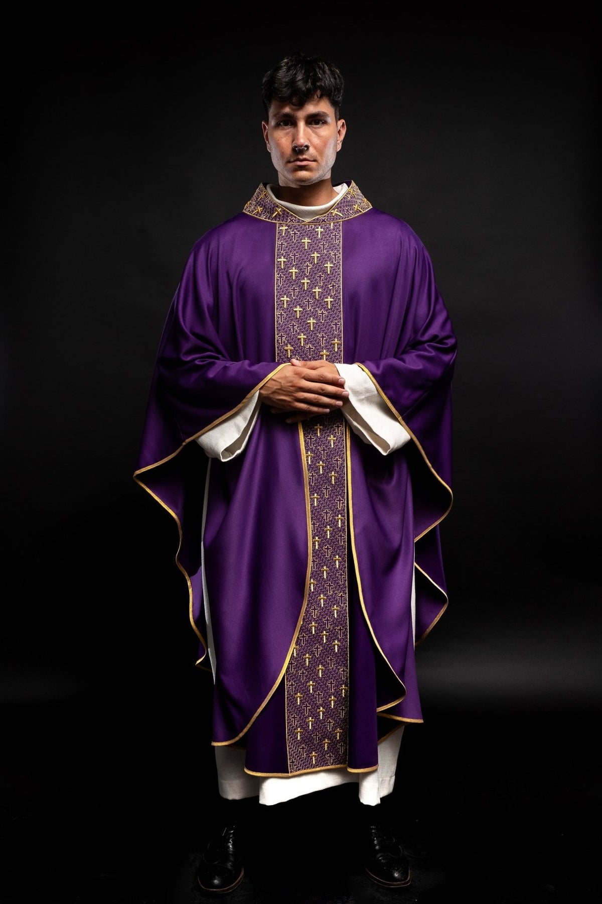Purple chasuble front view with cross embroidery and gold edging