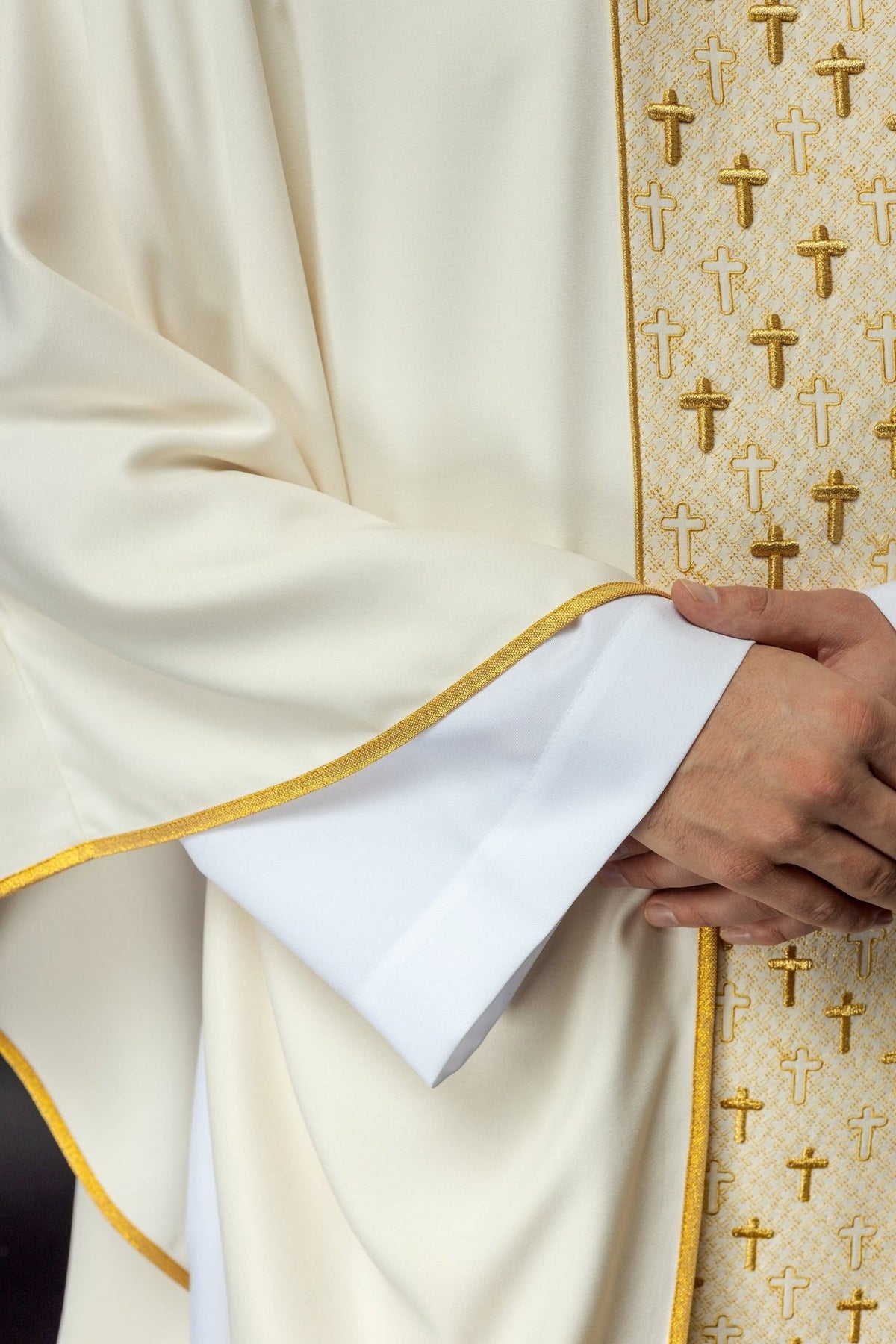 Ecru chasuble, close-up of gold edging and embroidered cross orphrey