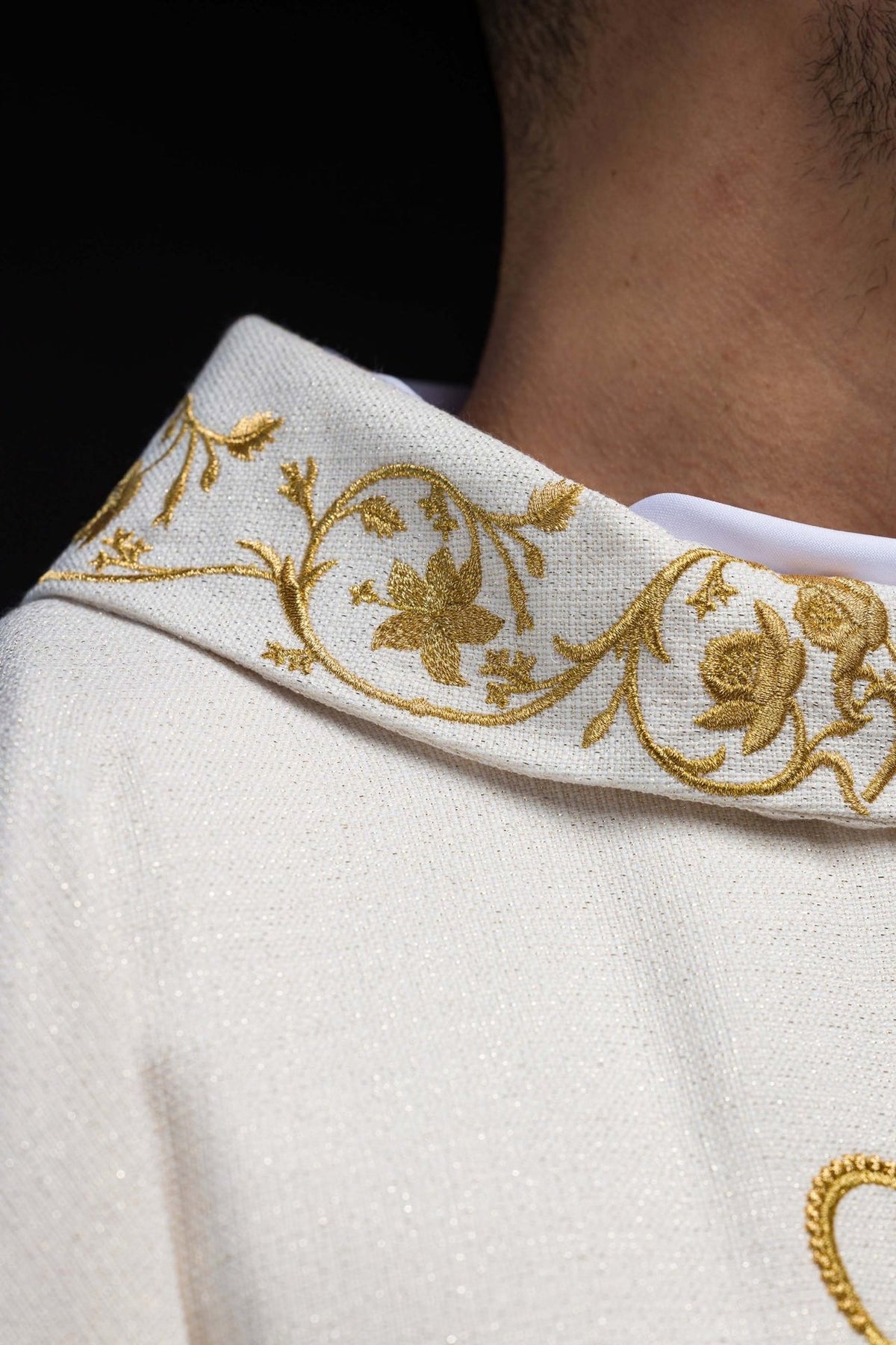 Liturgical chasuble close-up of gold floral embroidery on the stand-up collar