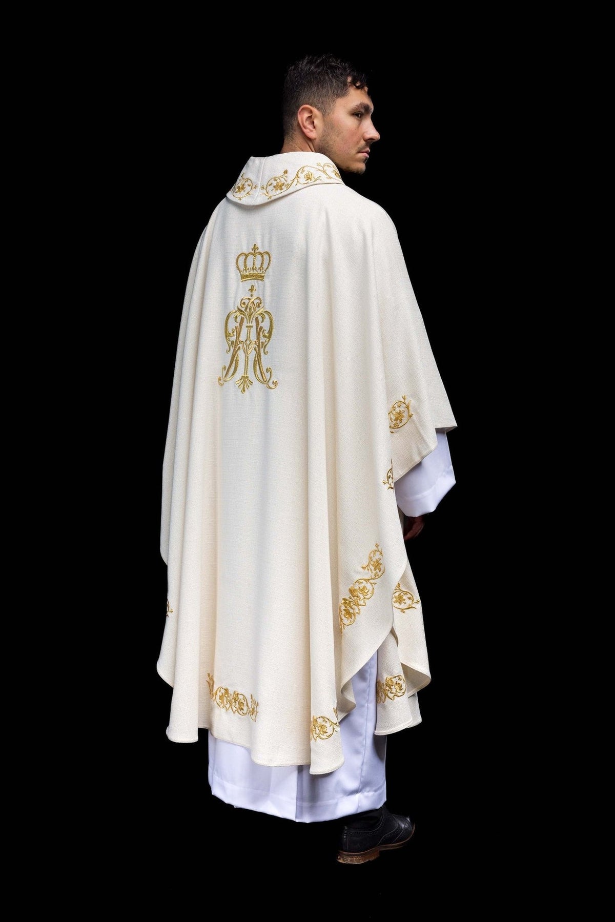 Liturgical chasuble rear three-quarter view with gold embroidery on collar, hem and sleeves