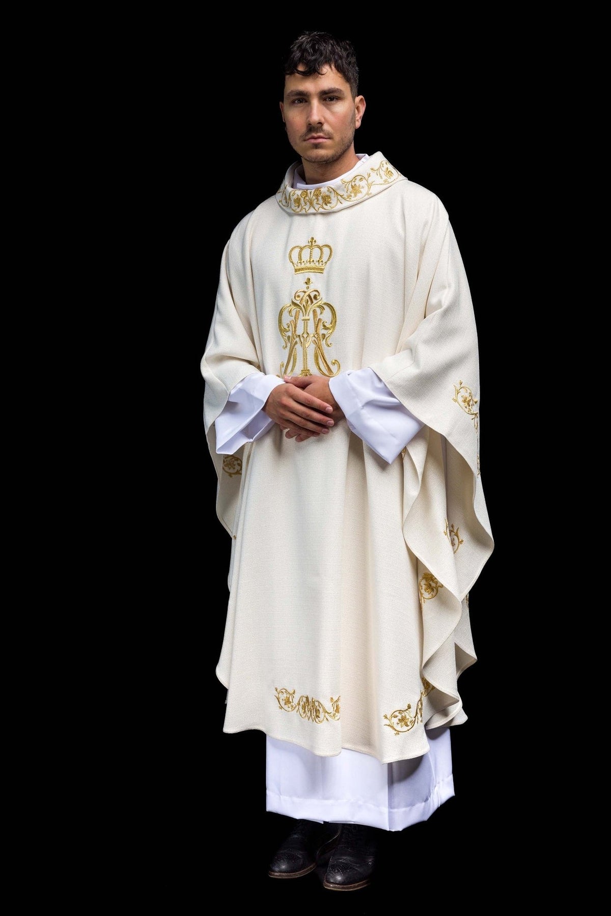 Liturgical chasuble front three-quarter view with gold Marian embroidery and floral trim