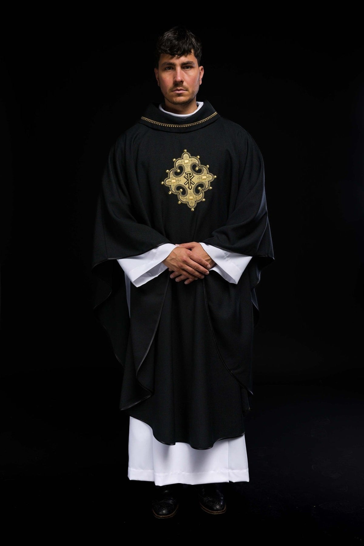 Black chasuble front view with gold cross embroidery
