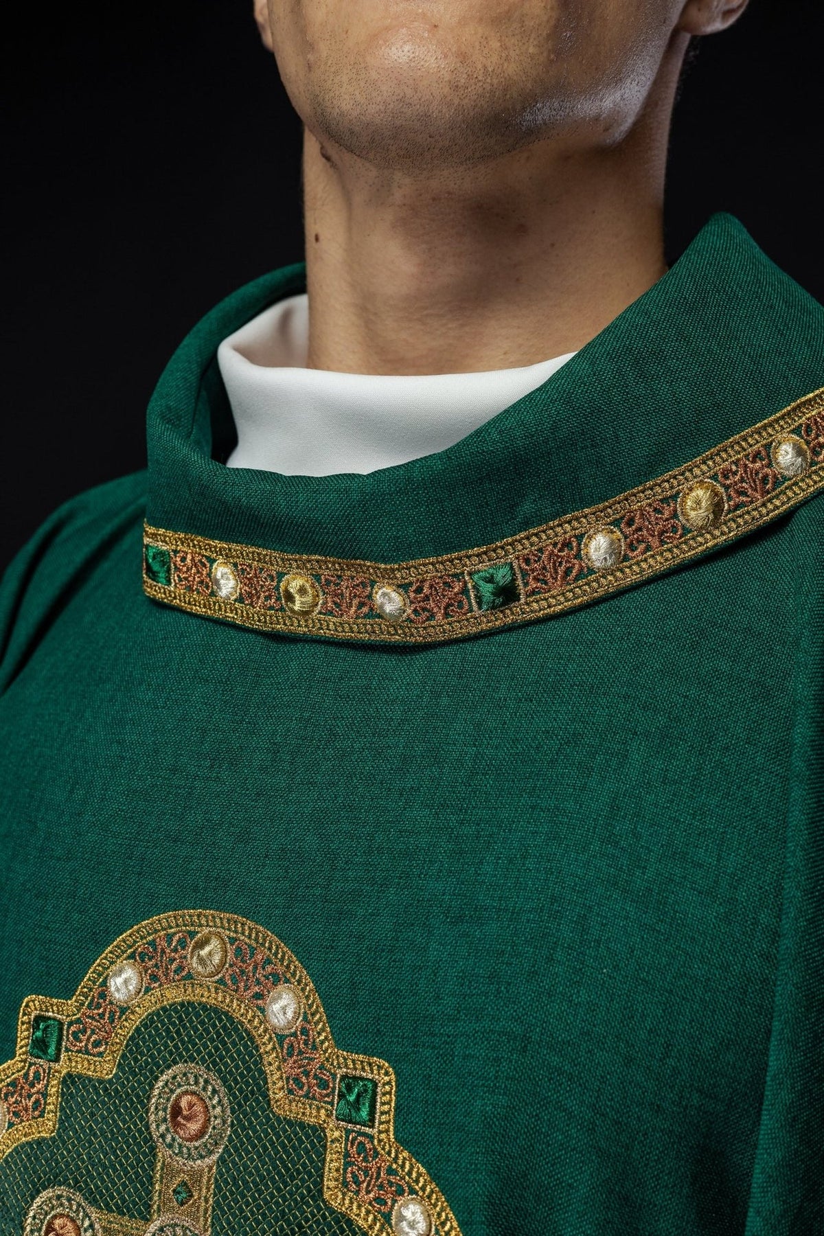 Green chasuble collar close-up with embroidered gold trim