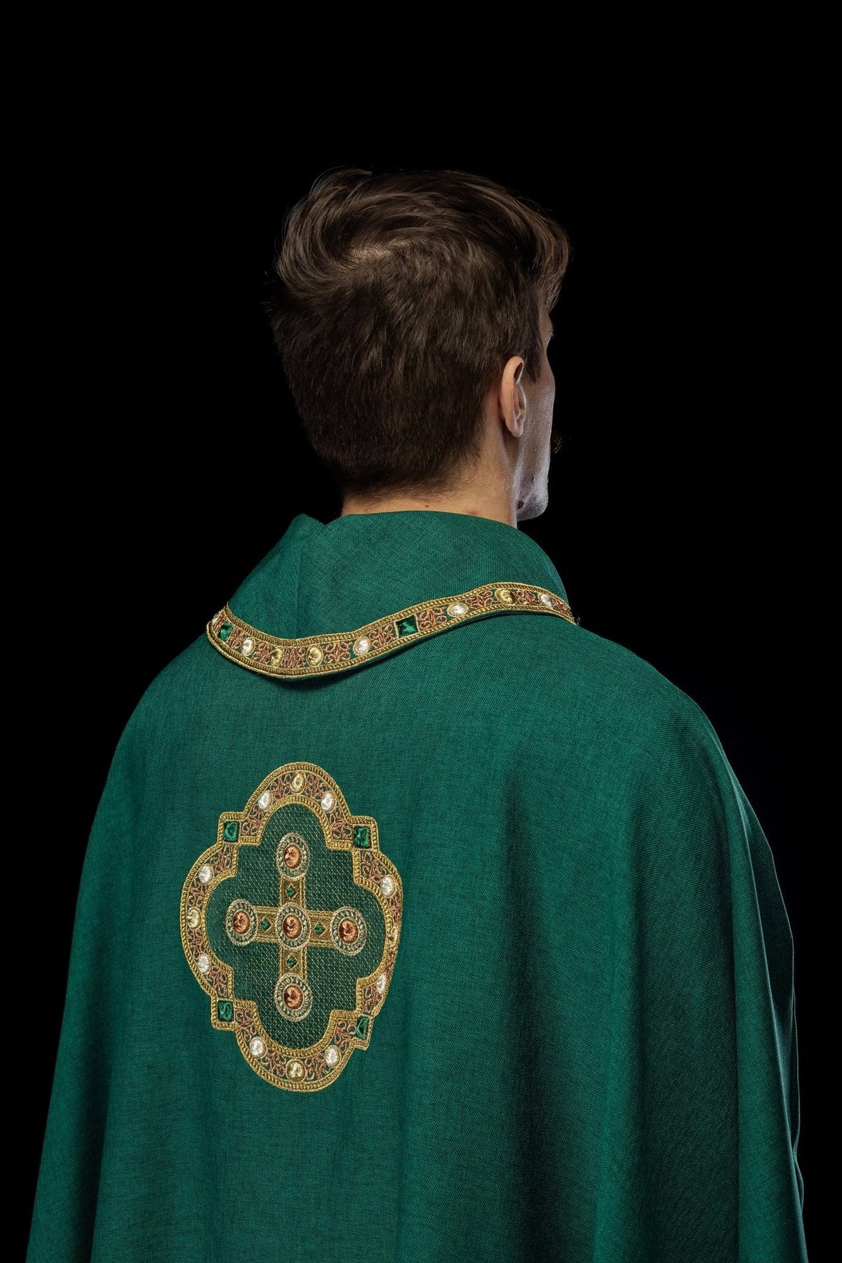 Green chasuble back view with cross embroidery and gold trim
