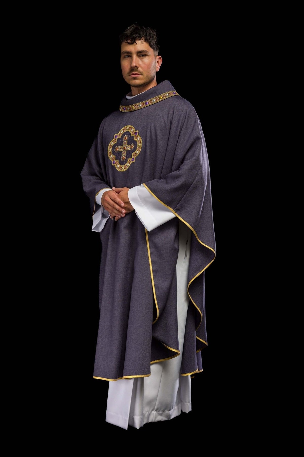 Purple chasuble side view with gold trim and embroidered cross
