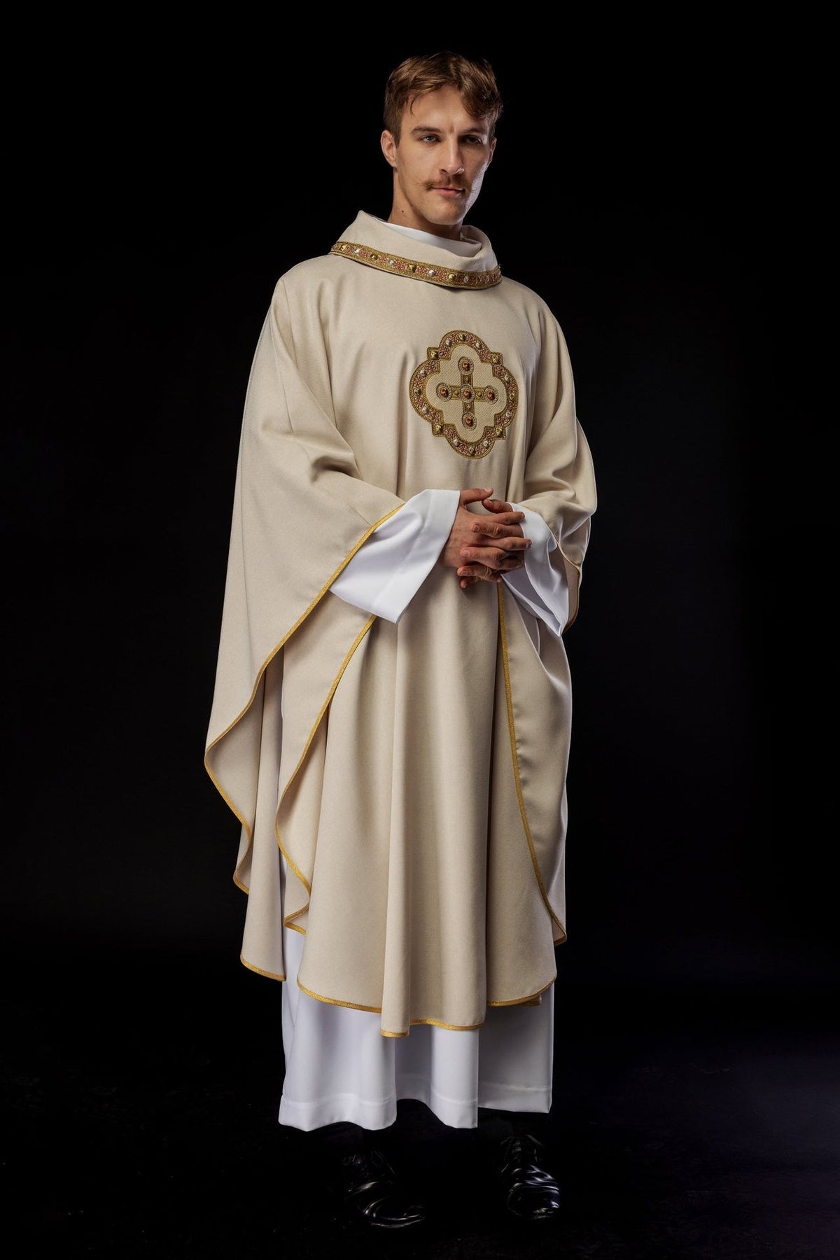 Ecru chasuble, worn front three-quarter view with gold trim