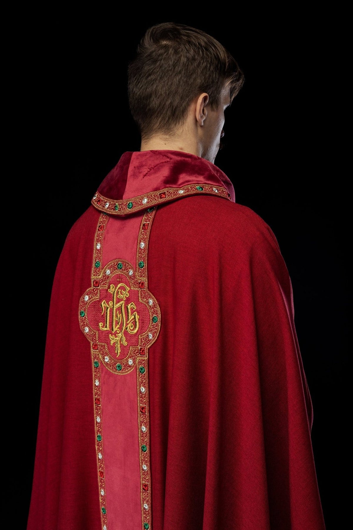 Red chasuble back view with embroidered IHS orphrey and trim