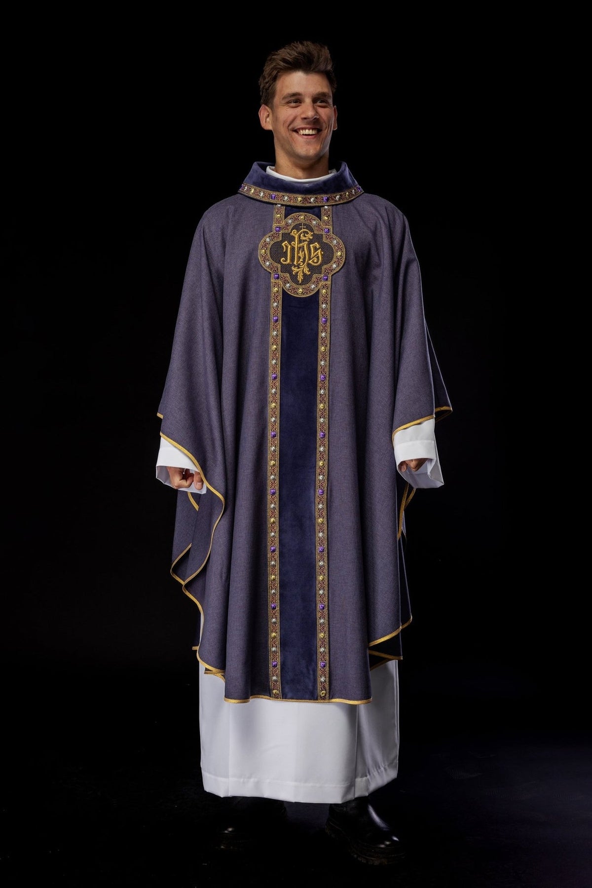 Purple chasuble worn front view, embroidered IHS orphrey and gold trim