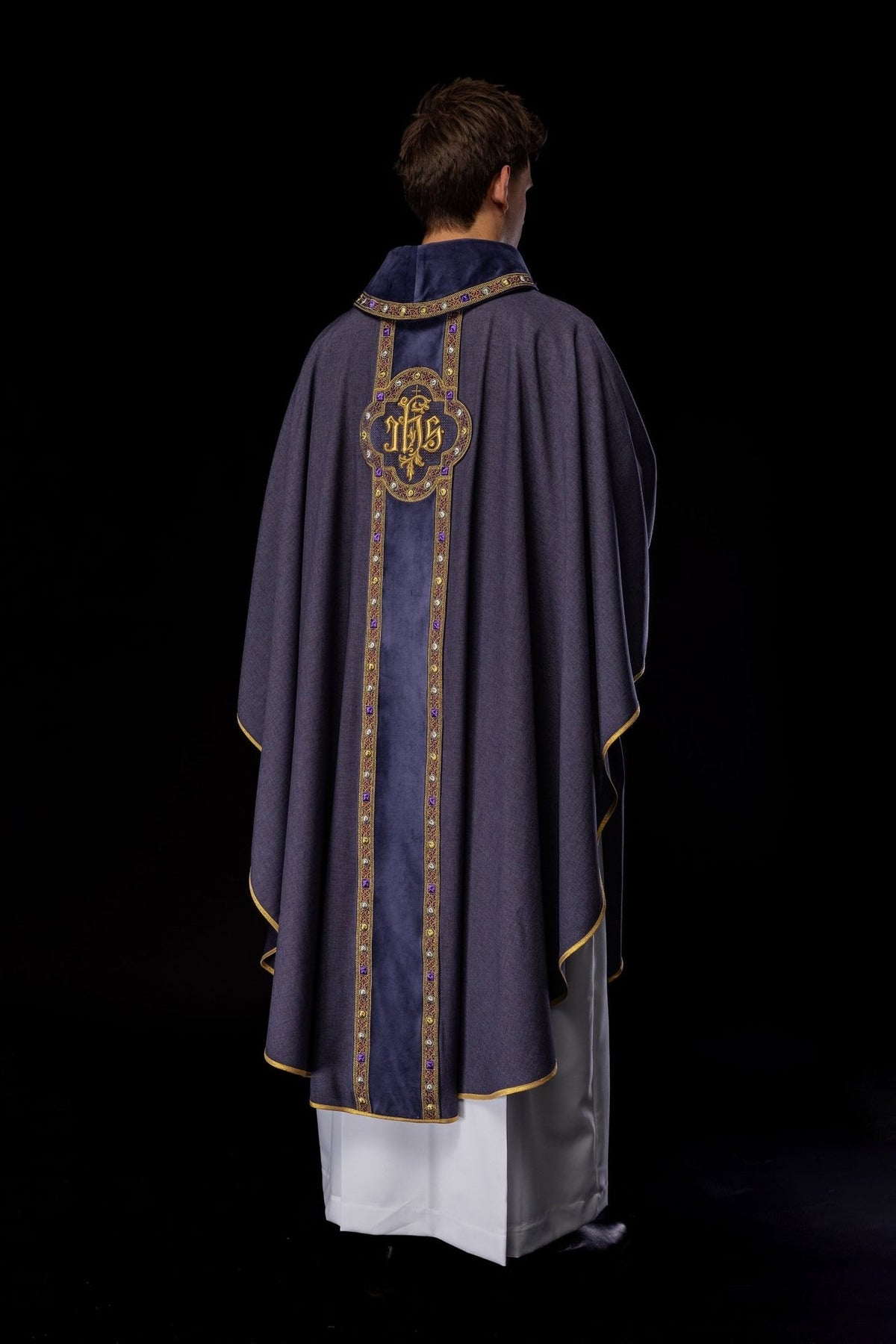 Purple chasuble worn back view with long embroidered orphrey and gold trim